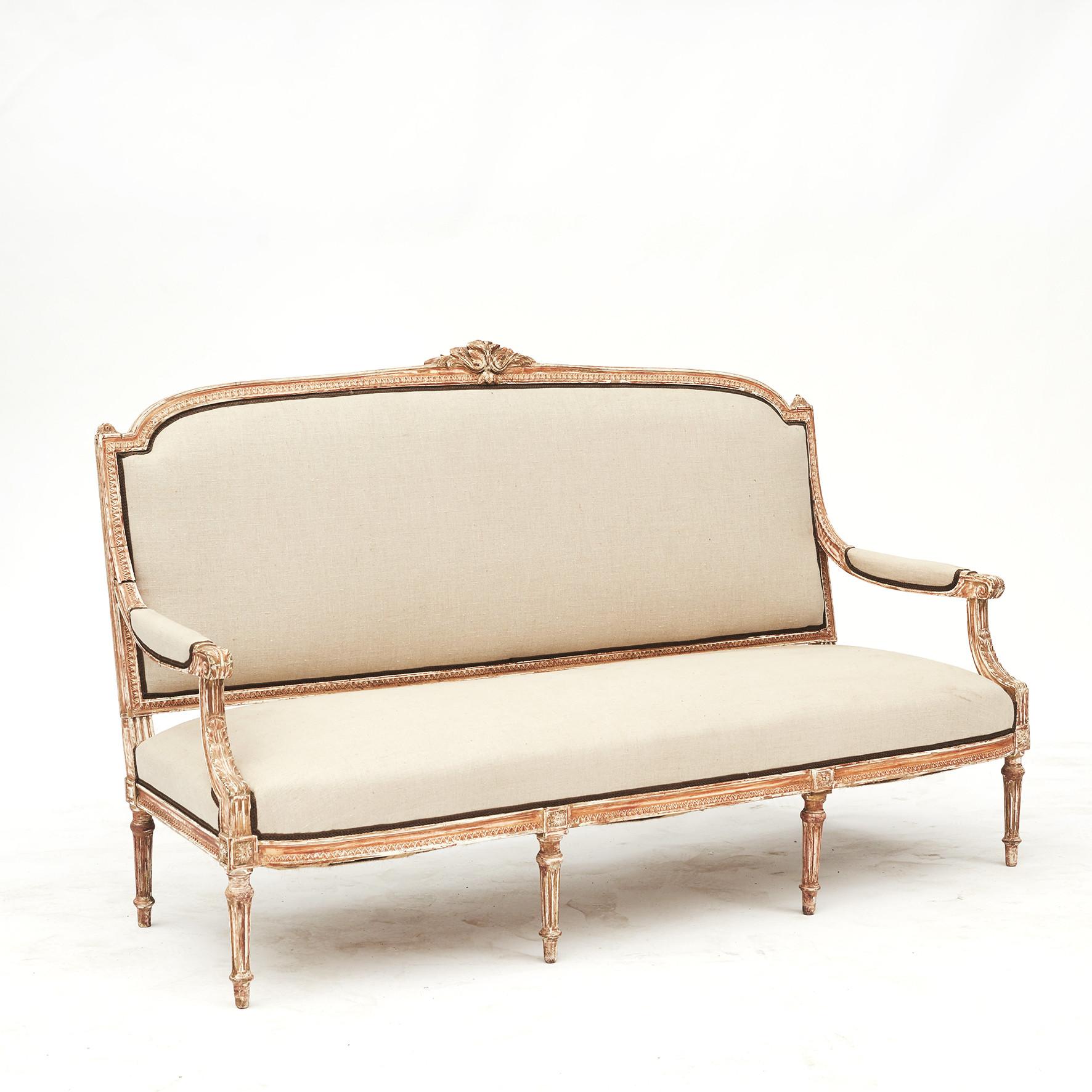 Louis XVI style canapé sofa (sofa bench), c. 1860.
Original undercoat paint with good patina.
Newly upholstered in gray canvas fabric.
France approx. 1860.