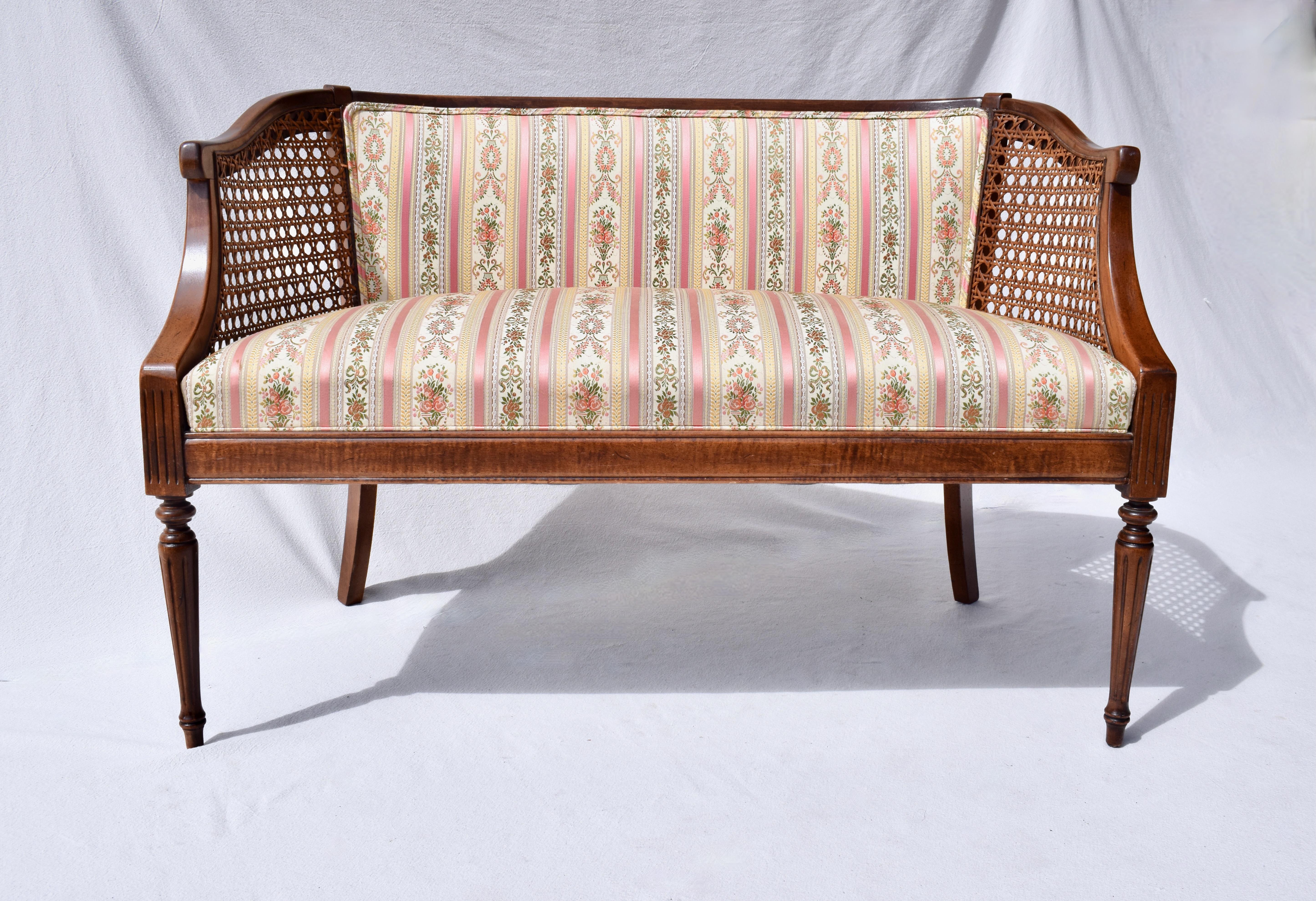 A very sweet small scale Louis XVI style settee in pink & green damask stripe jacquard floral upholstery; enhanced with a single custom goose down bolster cushion. Excellent vintage condition ready for use. Seat: 19