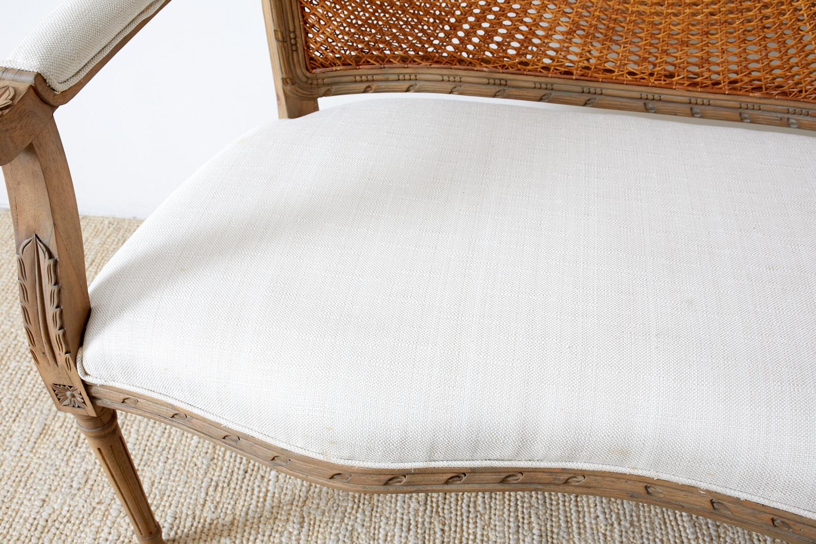20th Century French Louis XVI Style Caned Back Linen Settee