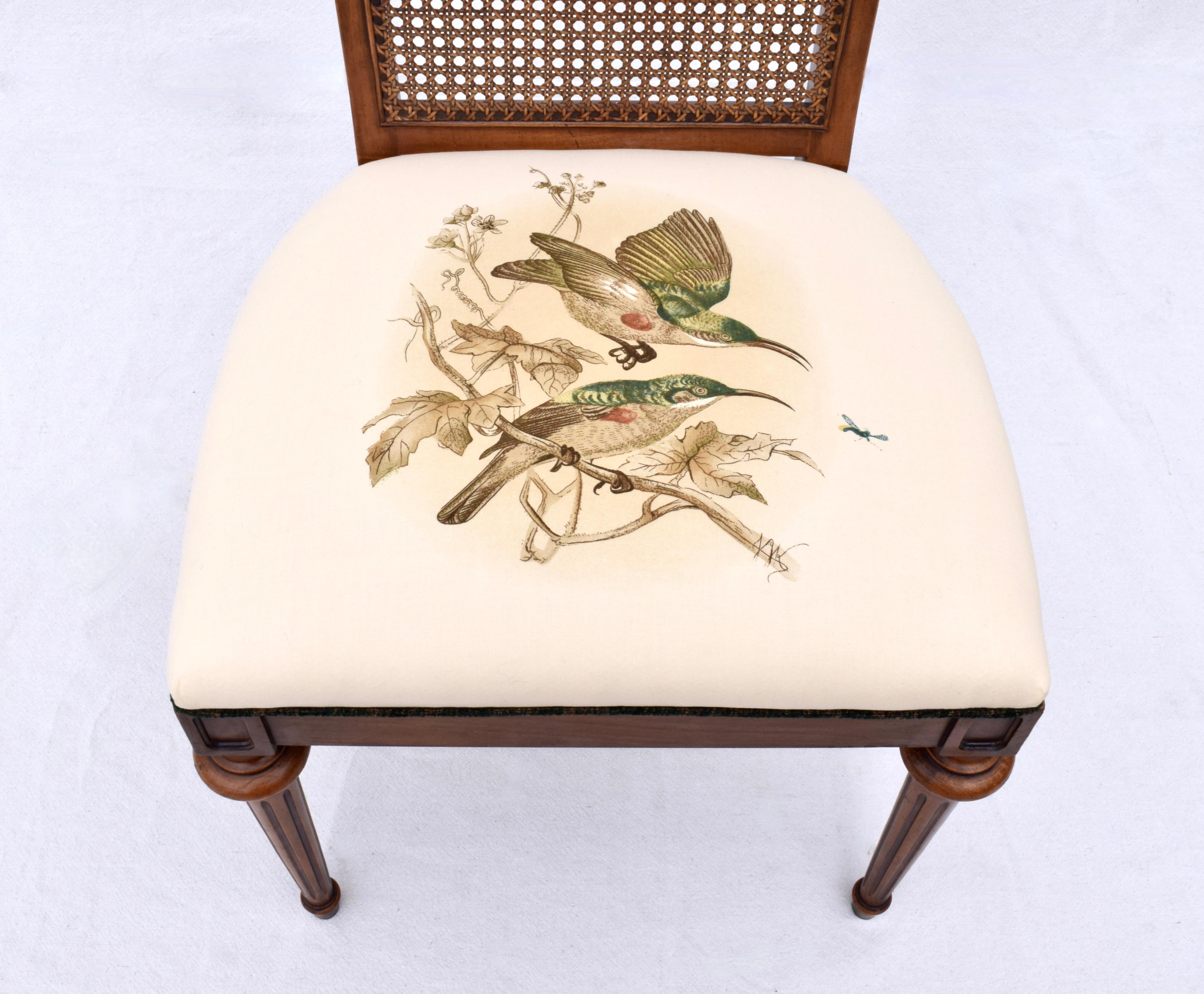A Louis XVI style side chair with gracefully curved cane back, fluted tapered legs and brass capped feet, Features new custom American song birds upholstered seat. Excellent vintage condition throughout suitable for dining and desk seating. Seat 19