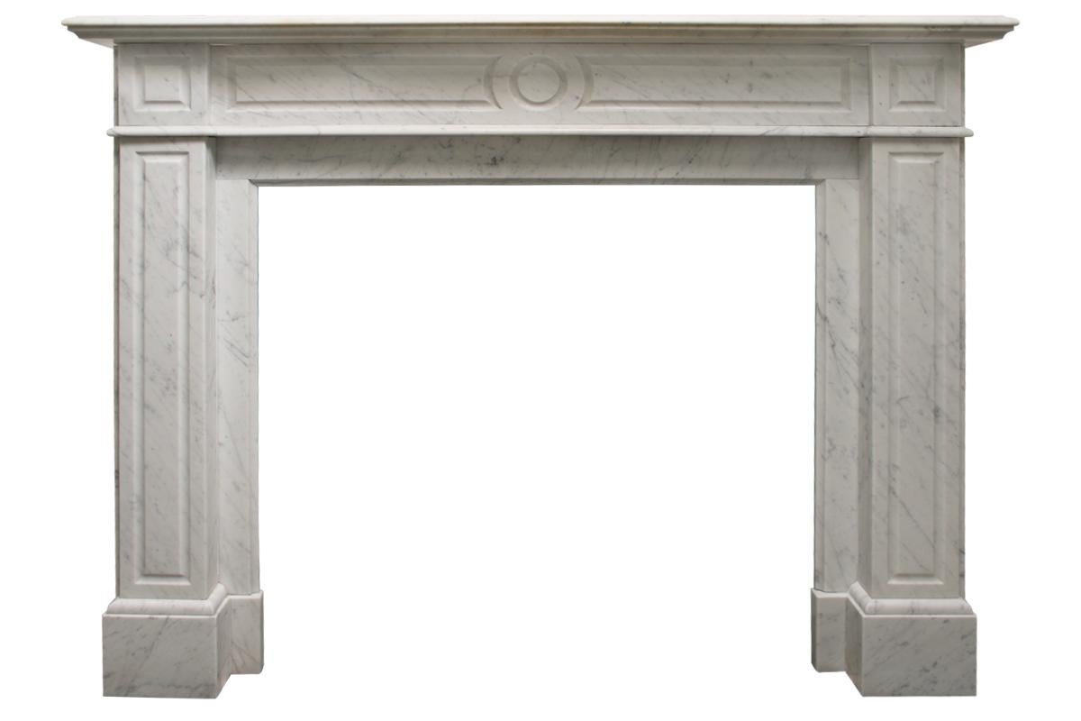 French Louis XVI style Carrara marble fireplace surround with simple panelled legs and frieze and square panels to the capitals also Circa 1890.
