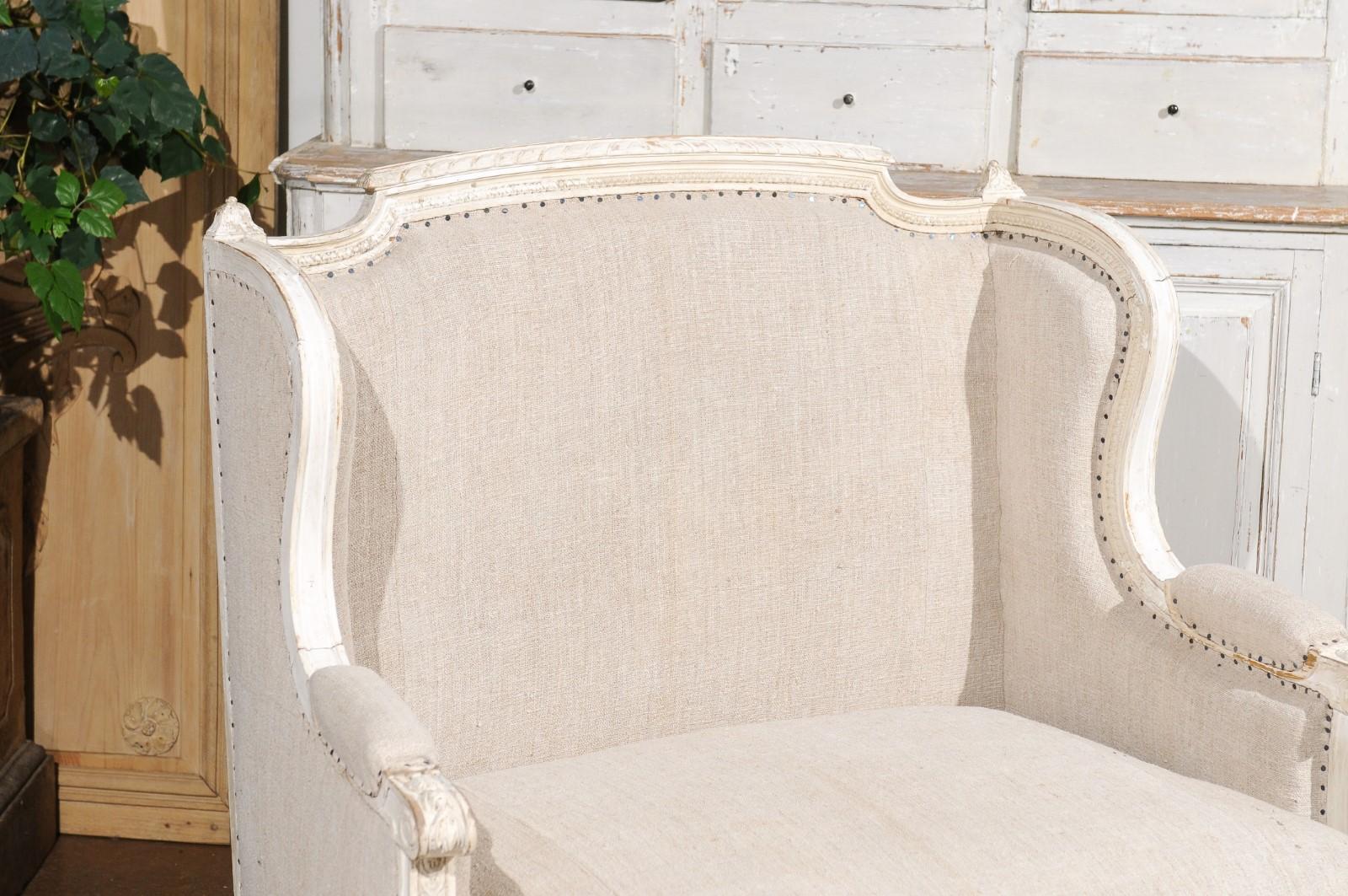20th Century French Louis XVI Style Carved and Painted Wood Marquise Wingback Armchair For Sale