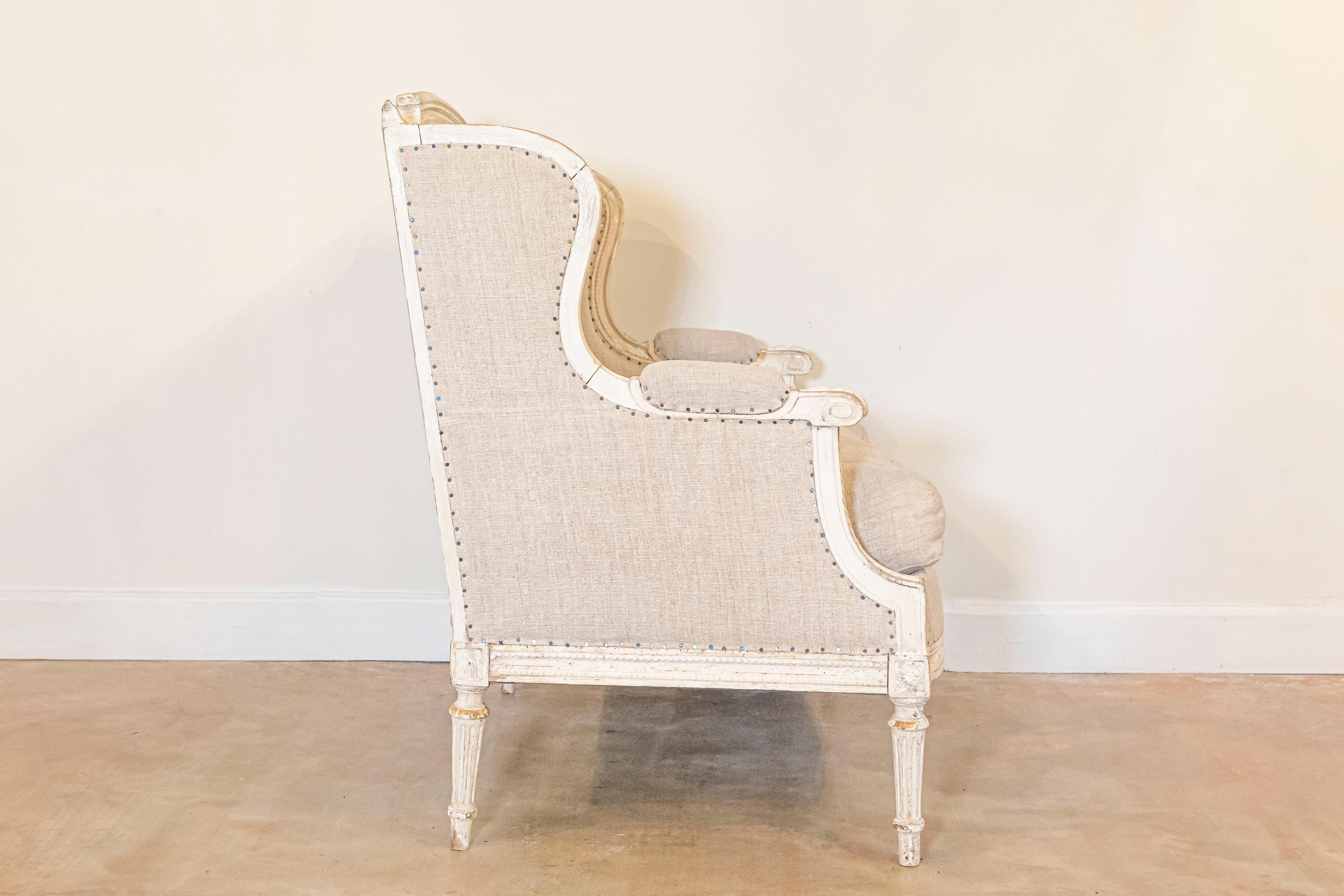 20th Century French Louis XVI Style Carved and Painted Wood Marquise Wingback Armchair For Sale