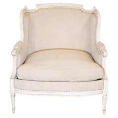 Fauteuil à oreilles marquise de style Louis XVI en bois sculpté et peint