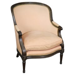 French Louis XVI Style Carved Bergere Chair with Pink Salmon Upholstery.