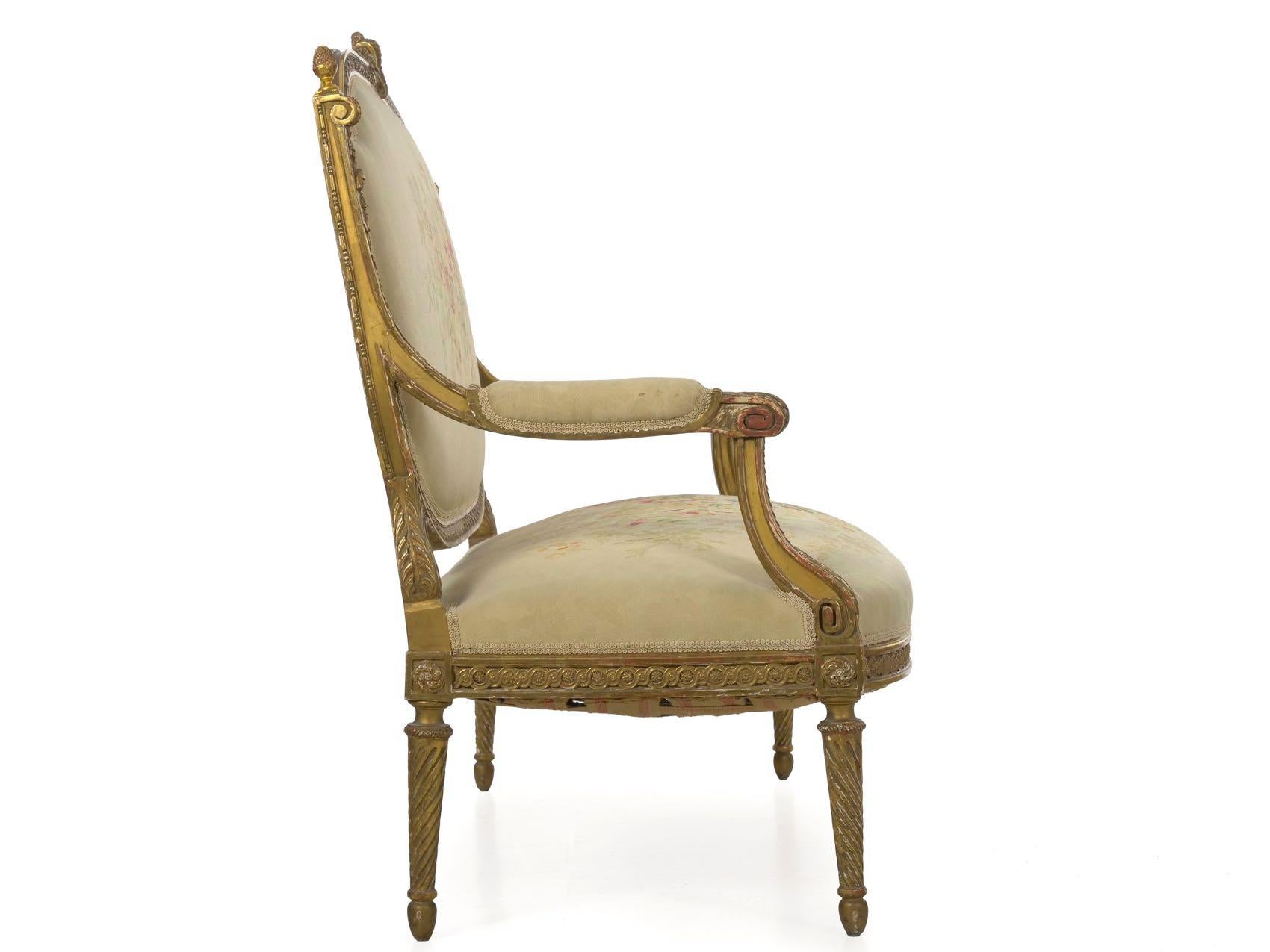 Beautifully carved and gilded, this striking Belle Époque settee is crafted in the typical manner of the Louis XVI taste during the fourth quarter of the 19th century. Tight infinite swirls and motifs of acanthus and foliage are tastefully developed