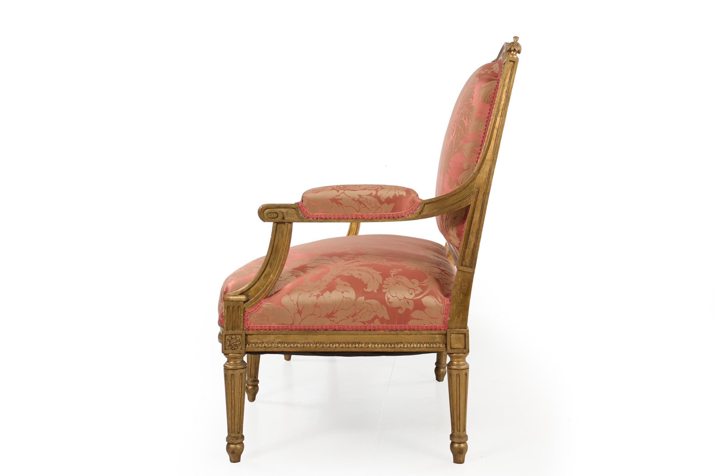 An absolutely gorgeous settee crafted in the Louis XVI taste during the first quarter of the 20th century, it is executed with period craftsmanship utilizing tiny wooden dowels to secure the tenon-mortised joinery and is beautifully finished in a