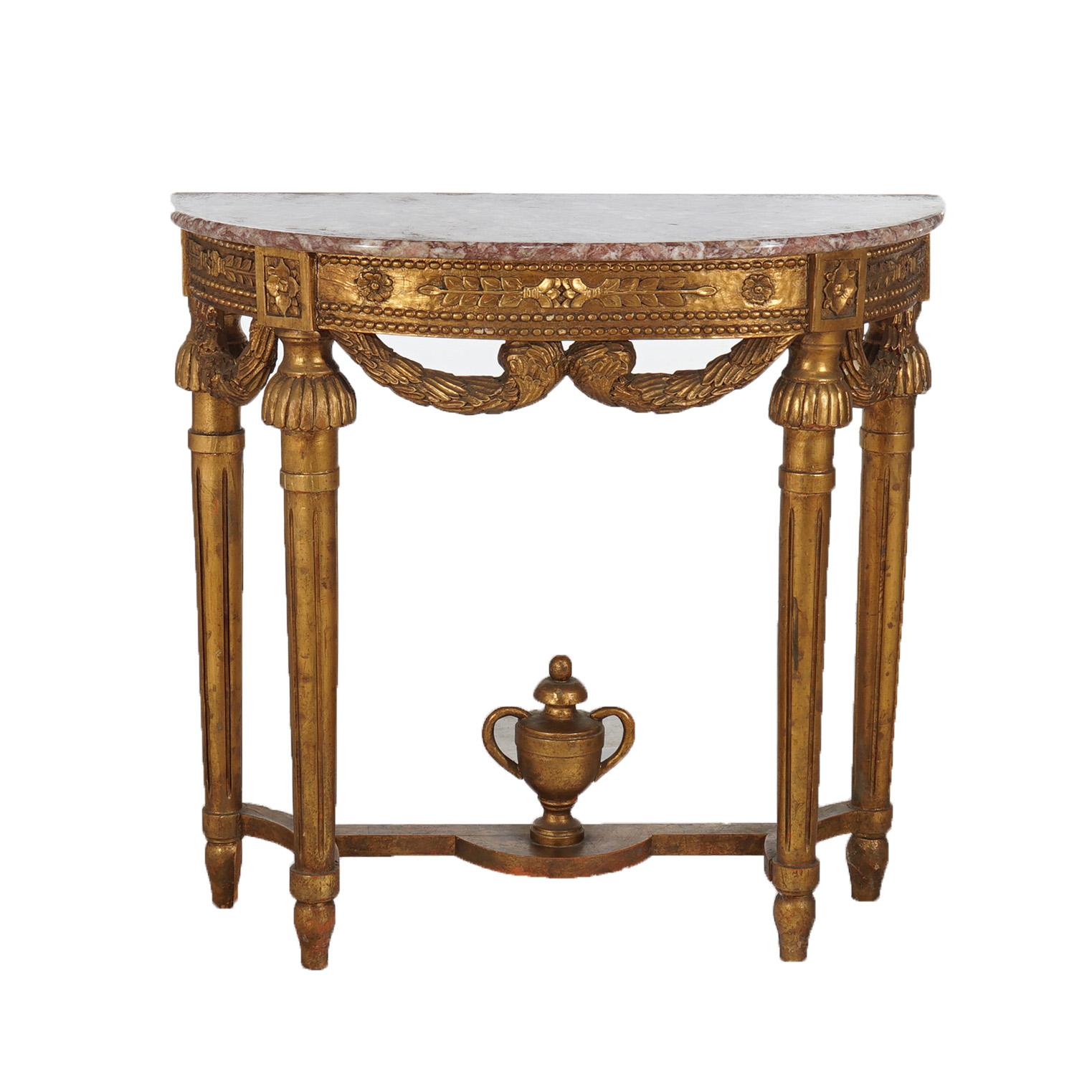 French Louis XVI Style Carved Giltwood & Marble Demilune Console Table with Garland Skirt, Tapered Legs & Urn Finial Stretcher, 20thC

Measures - 30.25