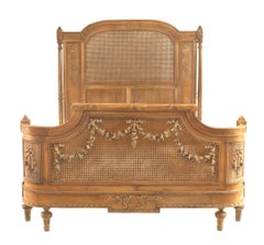 French Louis XVI Style Carved Walnut and Cane Bed