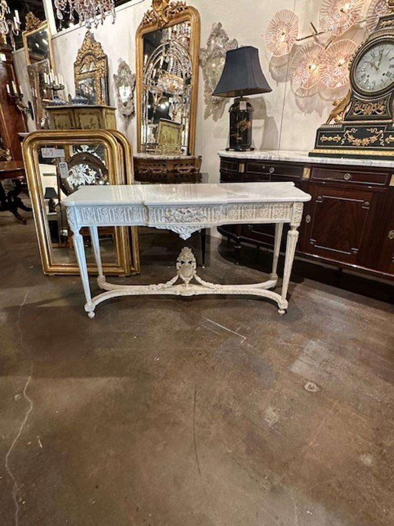 Late 19th century French Louis XVI style carved and painted console with Carrara marble top. Circa 1890. A favorite of top designers!
