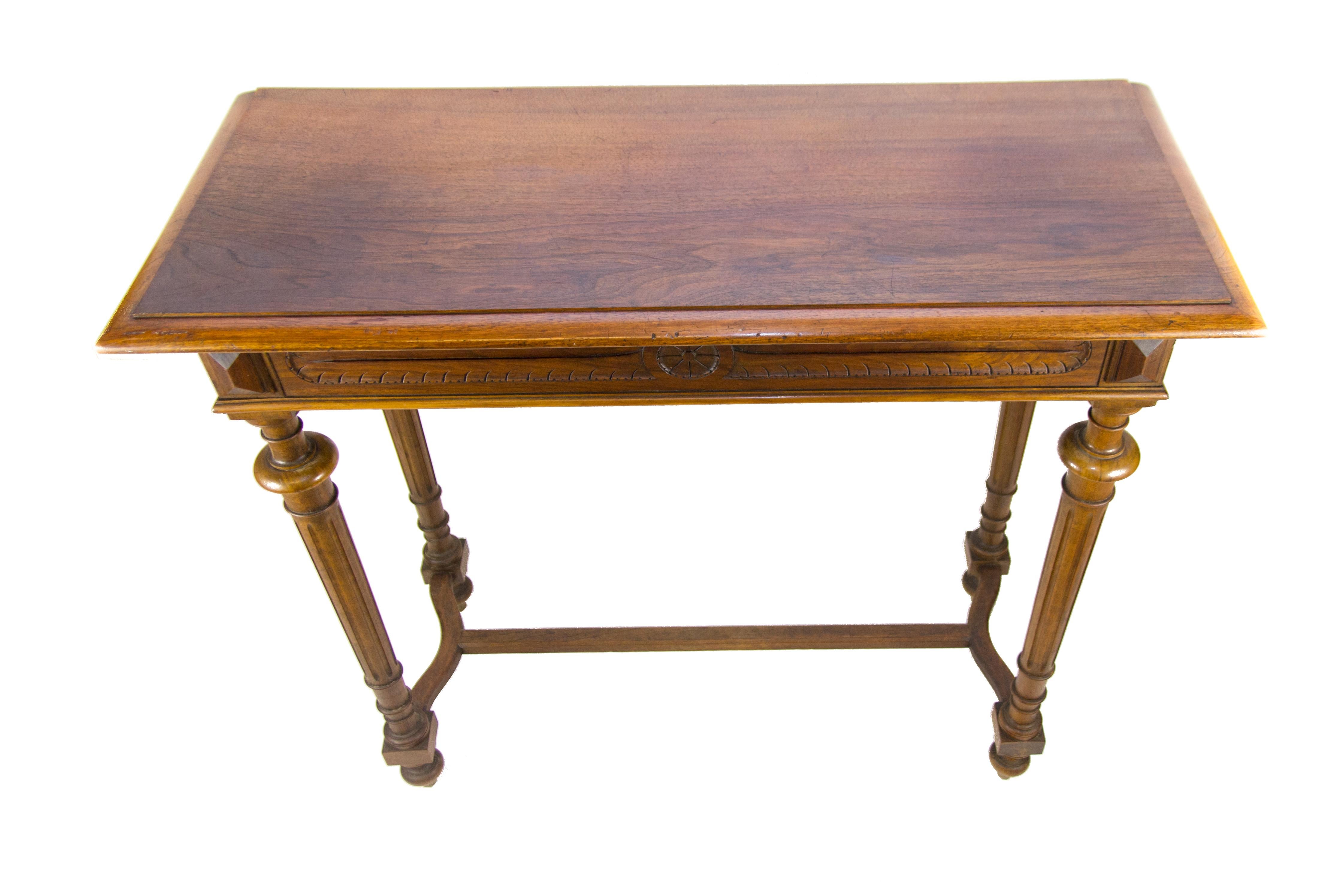 This elegant Louis XVI style console table is made of walnut wood. The table is supported by four tapered, fluted and carved legs so it does not have to be attached to the wall and can be used as a narrow center or end table, circa 1920s
Measures: