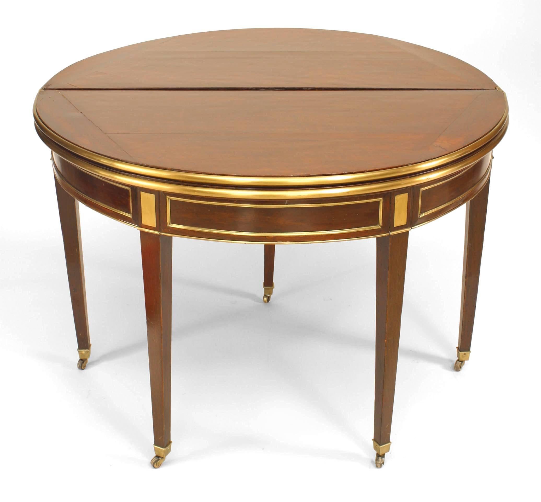 French Louis XVI-style (19th Century) demilune shaped double flip top console/game table with brass trim
