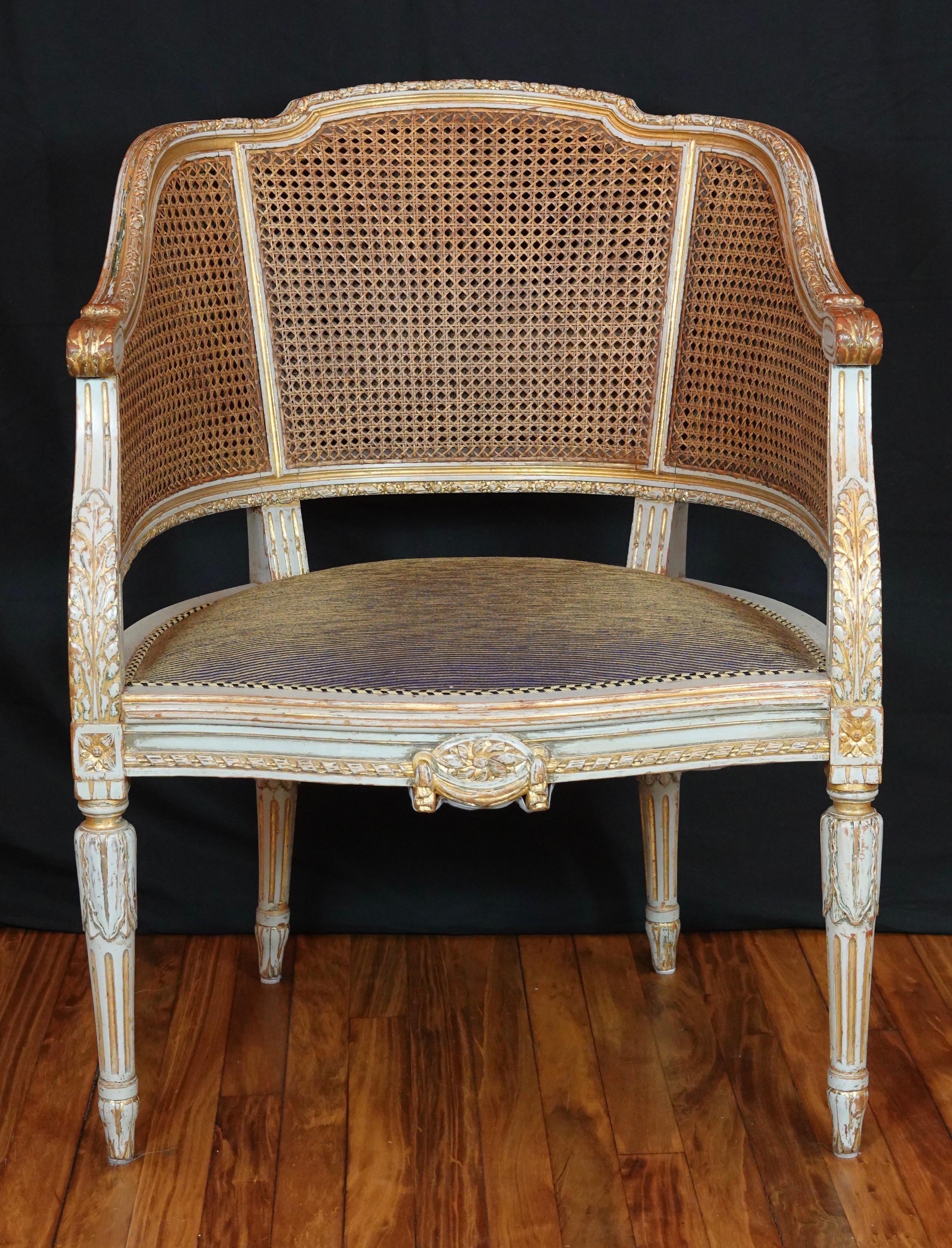 An elegant French caned desk chair or 