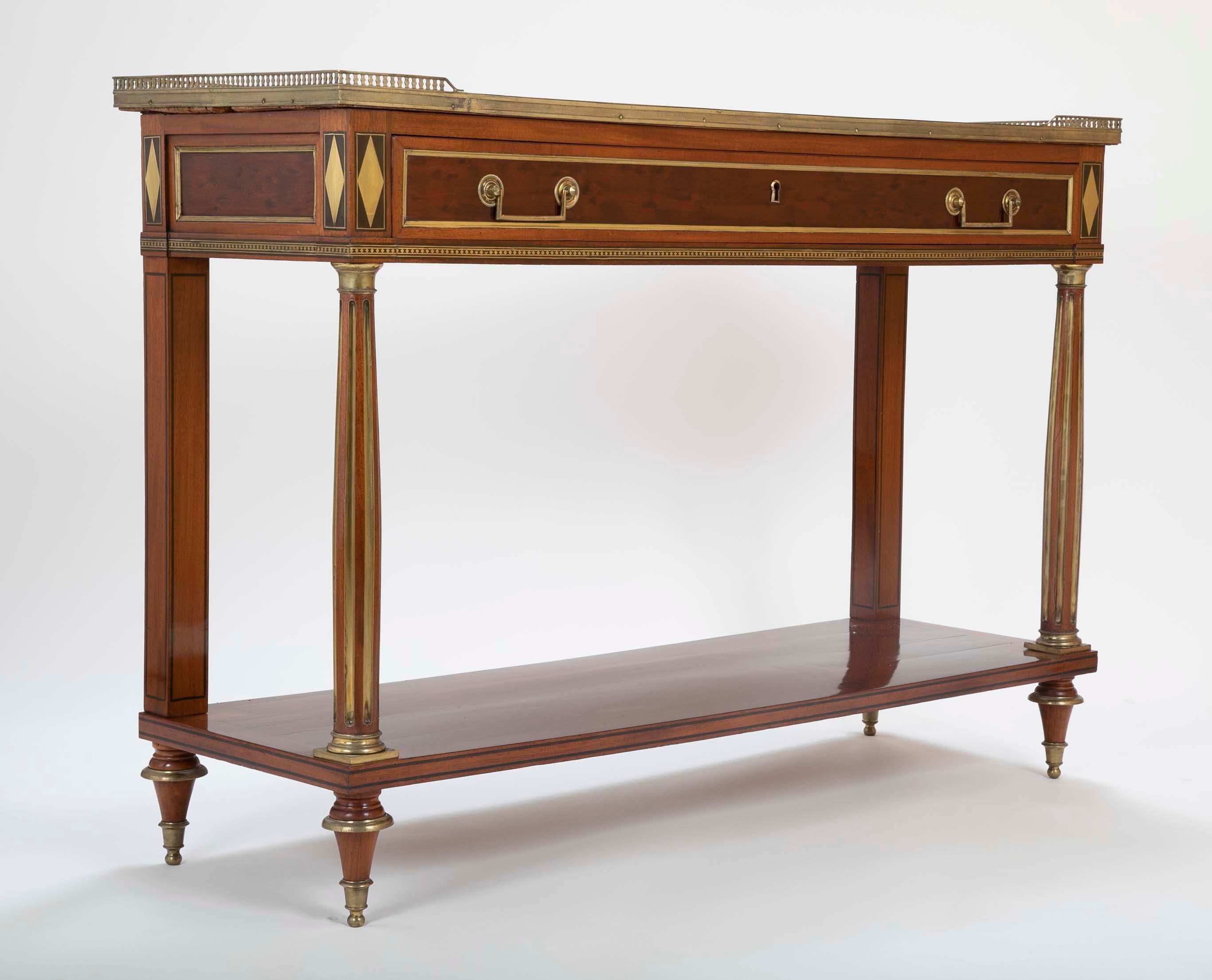 A beautiful French Louis XVI style mahogany desserte table having a marble top and wonderful brass gallery.
