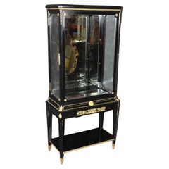 Vitrine française de style Louis XVI ébénisée et montée en bronze doré