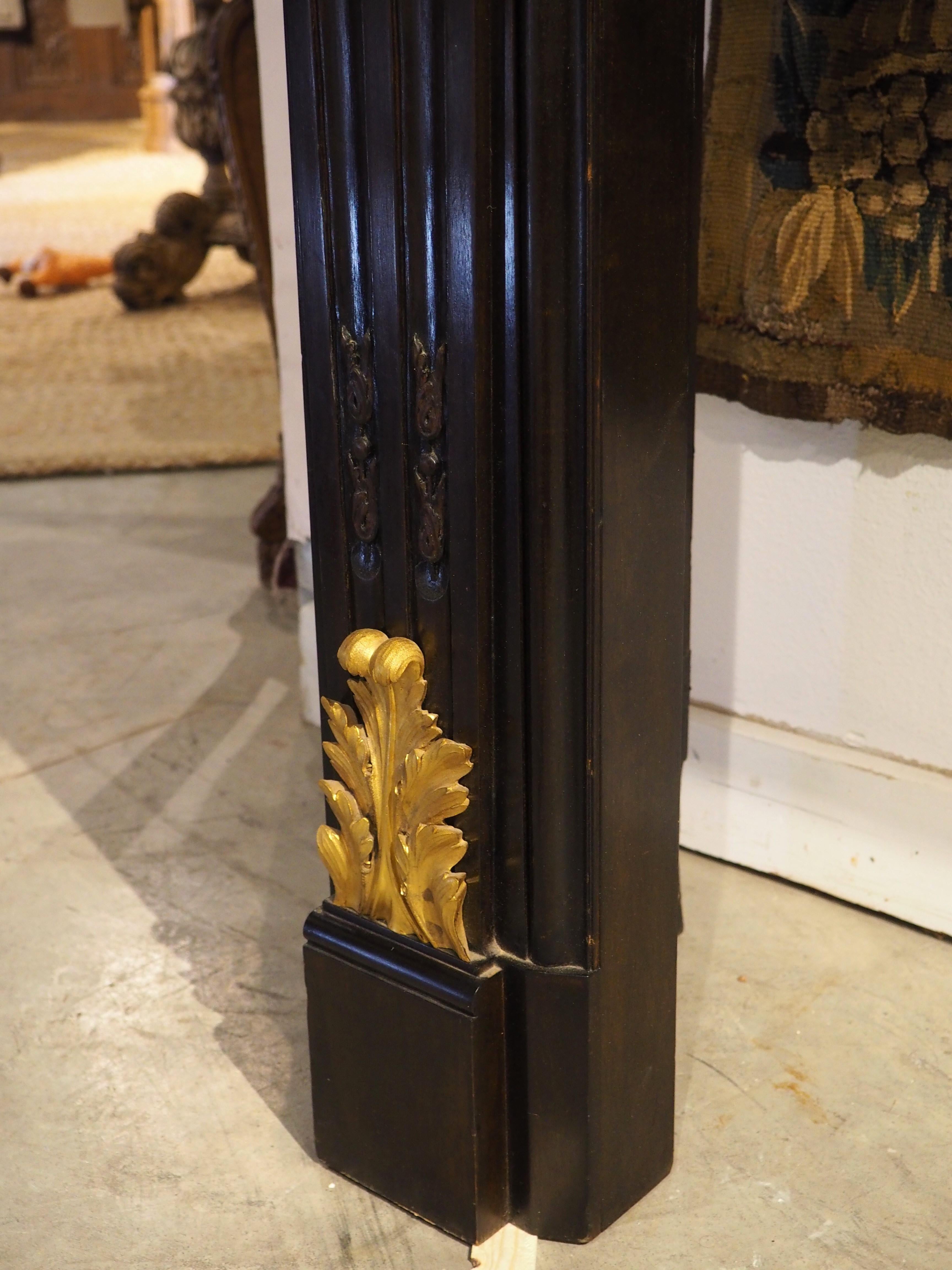 French Louis XVI Style Ebonized Wooden Mantel with Gilt Bronze Mounts, 20th C. For Sale 5
