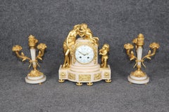 French Louis XVI Style Figural Bronze Ormolu and Marble Clock Set By Planchon