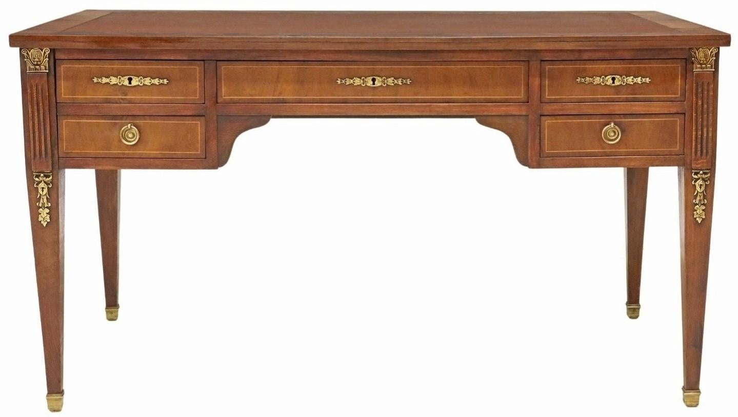 A stunning French mahogany bureau plat writing desk.

Exquisitely hand-crafted in France in the first half of the 20th century, most likely Parisian work, exceptionally executed in sophisticated and luxurious King Louis 16th taste with nods to