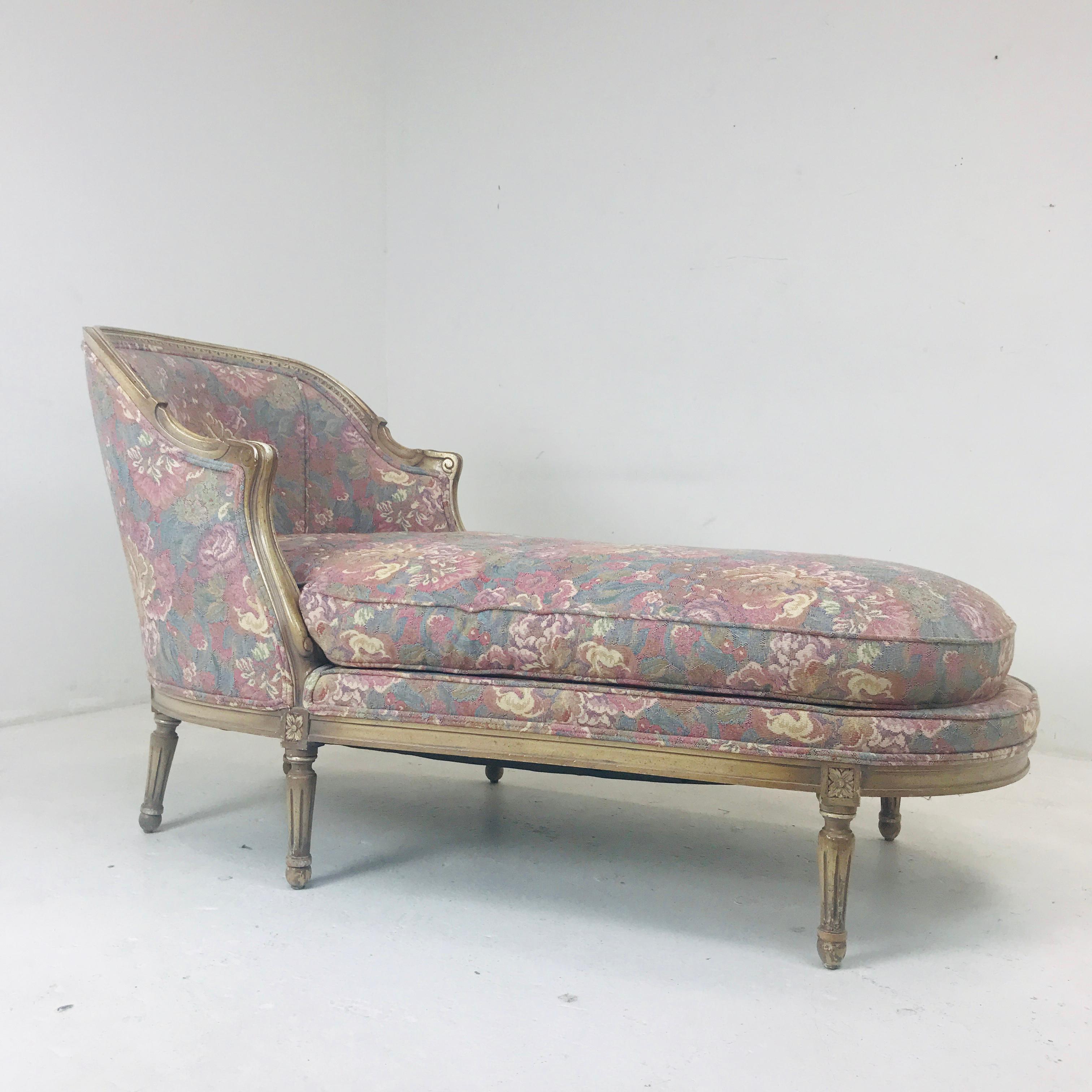 Chaise lounge/racamier/fainting sofa upholstered in a floral pale tone fabric.