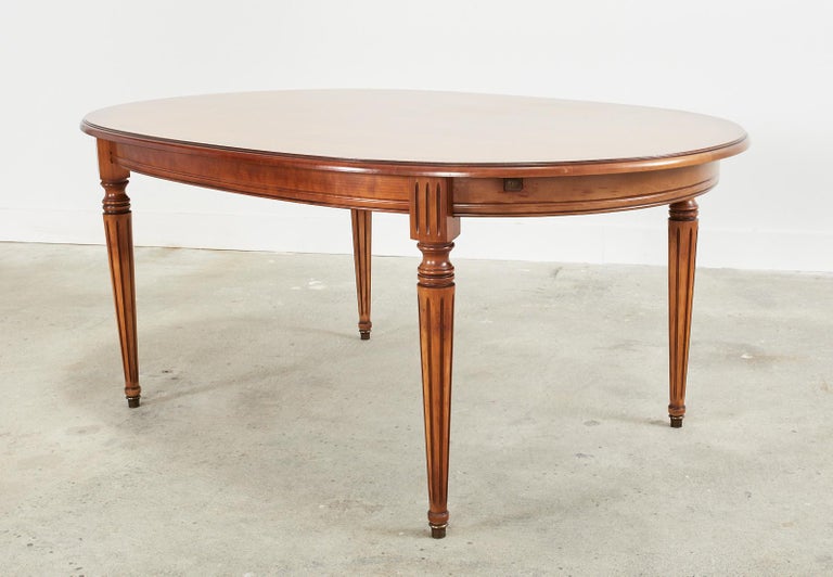 Hand-Crafted French Louis XVI Style Fruitwood Oval Dining Table with Leaves For Sale