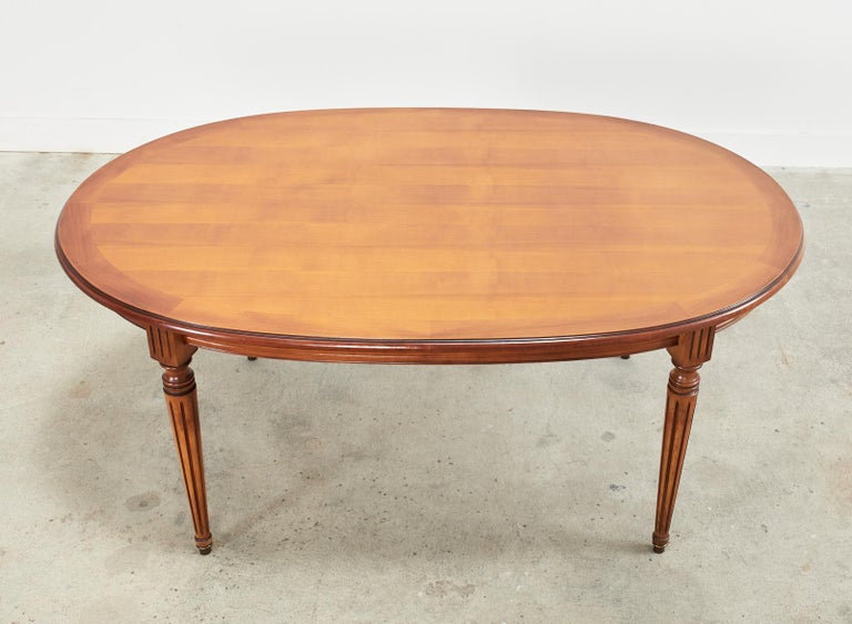 French Louis XVI Style Fruitwood Oval Dining Table with Leaves In Good Condition For Sale In Rio Vista, CA