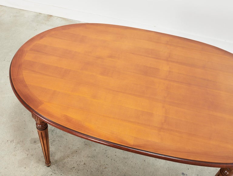 20th Century French Louis XVI Style Fruitwood Oval Dining Table with Leaves For Sale