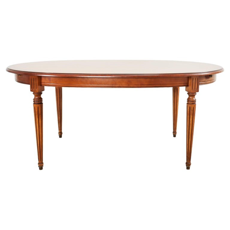 French Louis XVI Style Fruitwood Oval Dining Table with Leaves For Sale