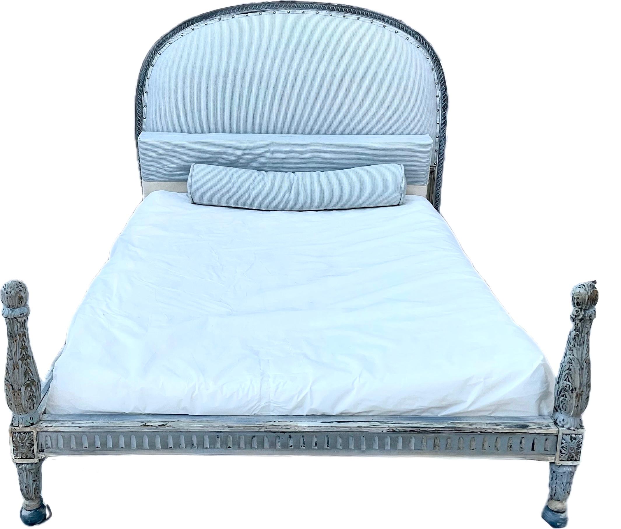 Exceptional 19th Century Louis XVI Style French Bed, Full Size. Bed features a wooden frame with an arched upholstered headboard, carved side rails, and two turned baluster posts on footboard. Frame is finished in a lovely light blue and gray color.