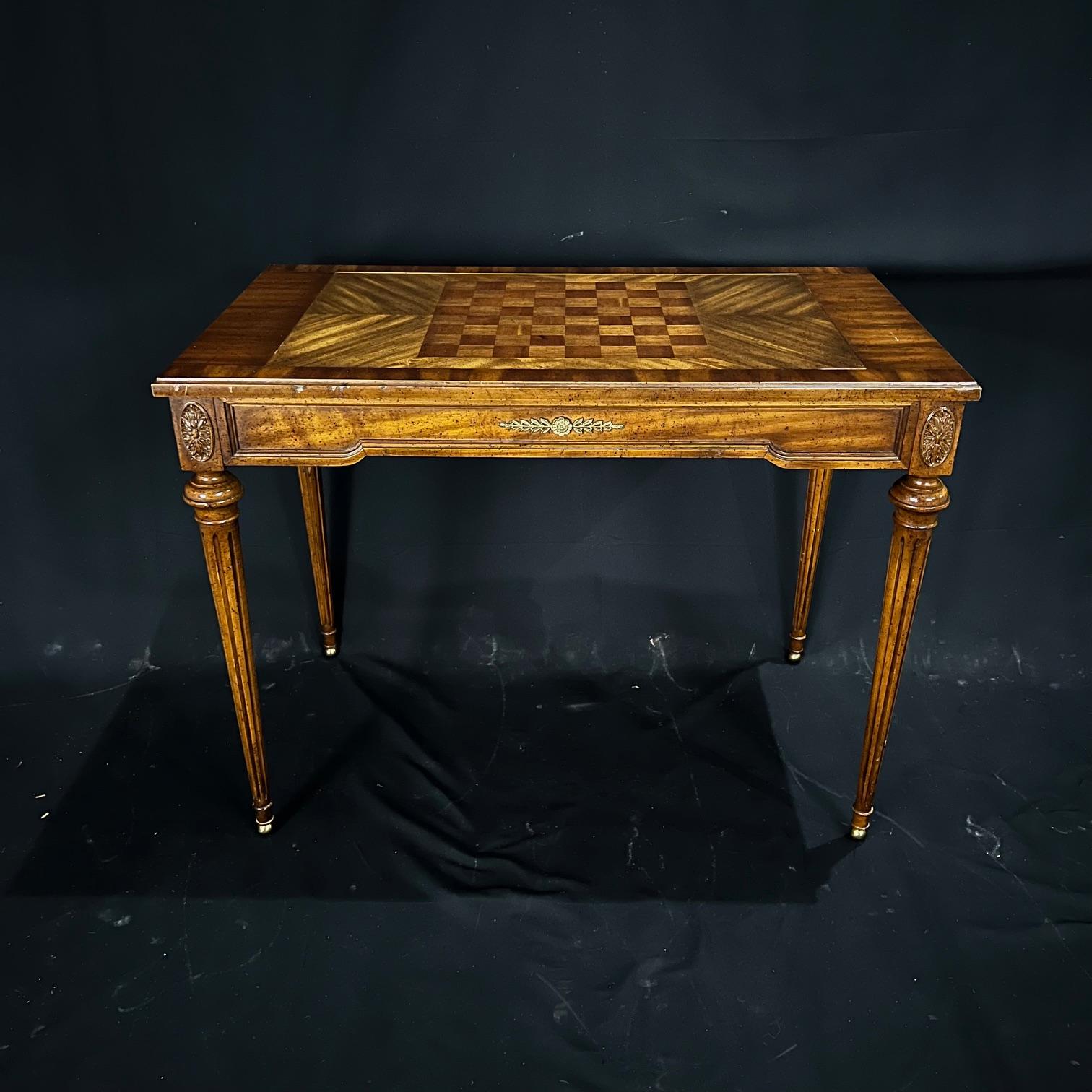  
Elegant and versatile French Louis XVI style console game table with hidden backgammon board. Top flips over for beautiful inlaid chess or checkers board, or remove the top completely for backgammon game board. Flip top for lovely wood surface.