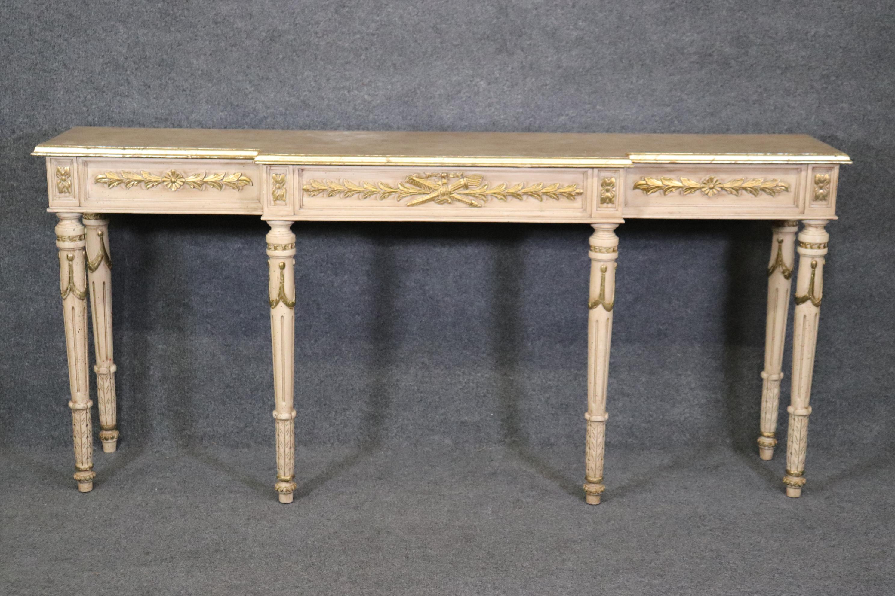 This is a beautiful console table with a distressed gilded and painted finish and faux marble painted top. The table dates to the 1990s era and measures 72 wide x 17 deep x 33 tall. 



We can help with shipping to the ground floor or elevator