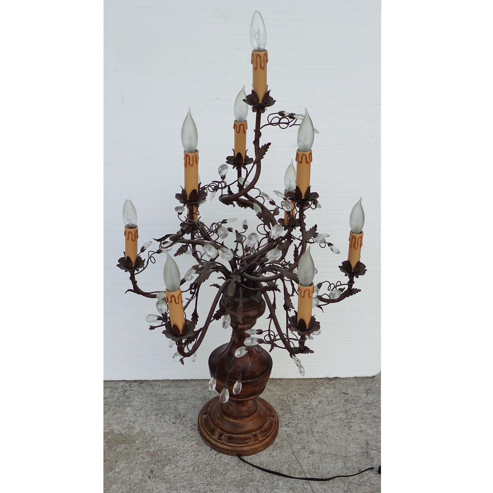 10 Light Vintage Candelabra Lamp

Mid century French Louis XVI style gilt bronze and crystal multi light table lamp embellished with gilt bronze floral arms and accent leaves.

Wired and working.
 