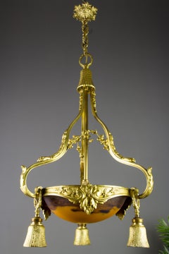Lustre à quatre lumières en bronze doré et verre de style Louis XVI par Degué