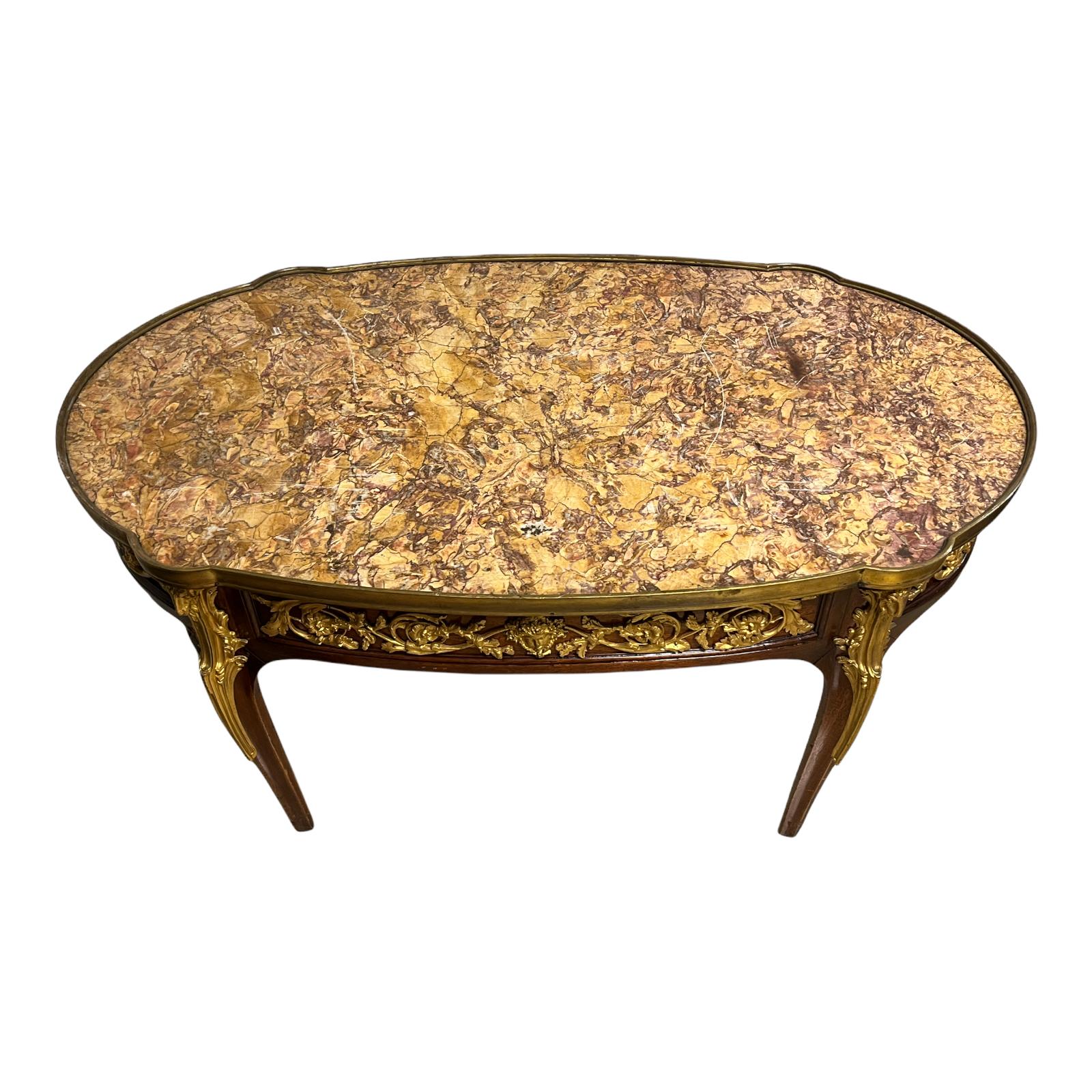 Very fine quality French Louis XVI style Gilt Bronze mounted marble top Coffee table.