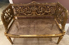 French Louis XVI Style Gilt Carved Back Settee with Caned Seat