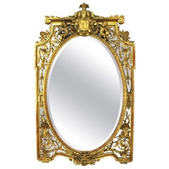 French Louis XVI Style Giltwood Mirror with Putti and Oval Center, 19th Century