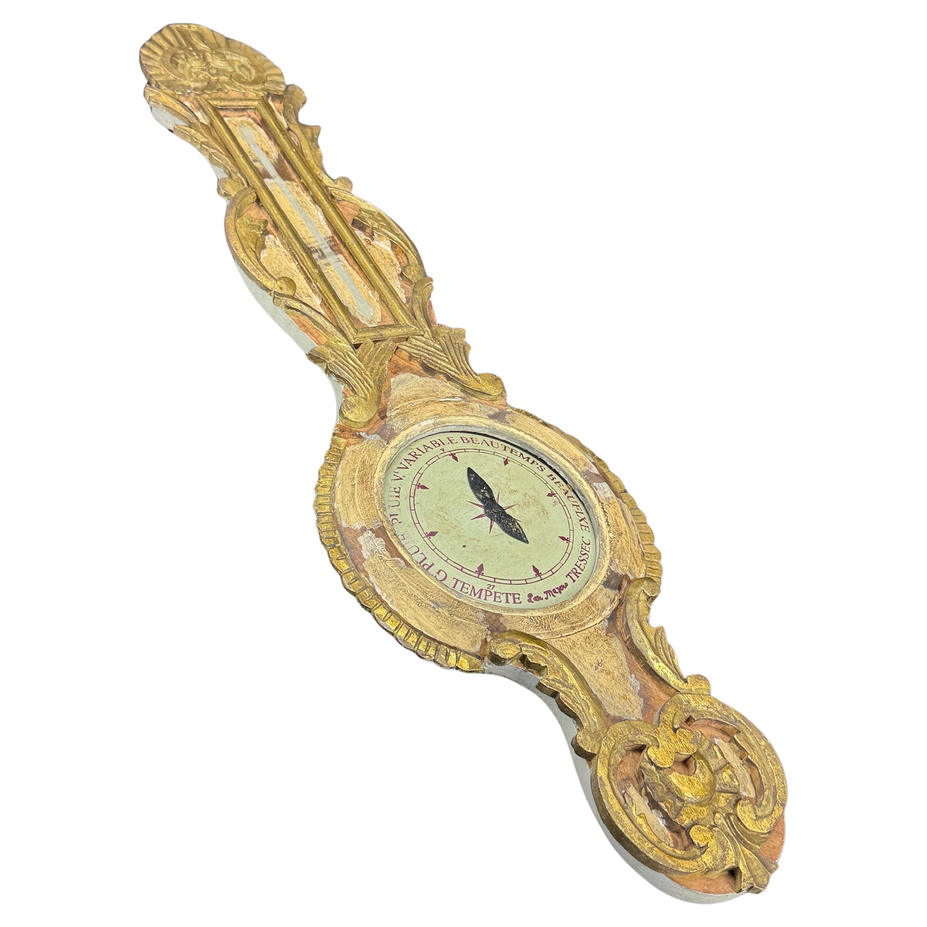 A beautiful replica of a 18th Century French gold gilt barometer. Wonderfully ornate, carved wood frame with gold gilt and painted surface that will add a touch of elegance to any home.