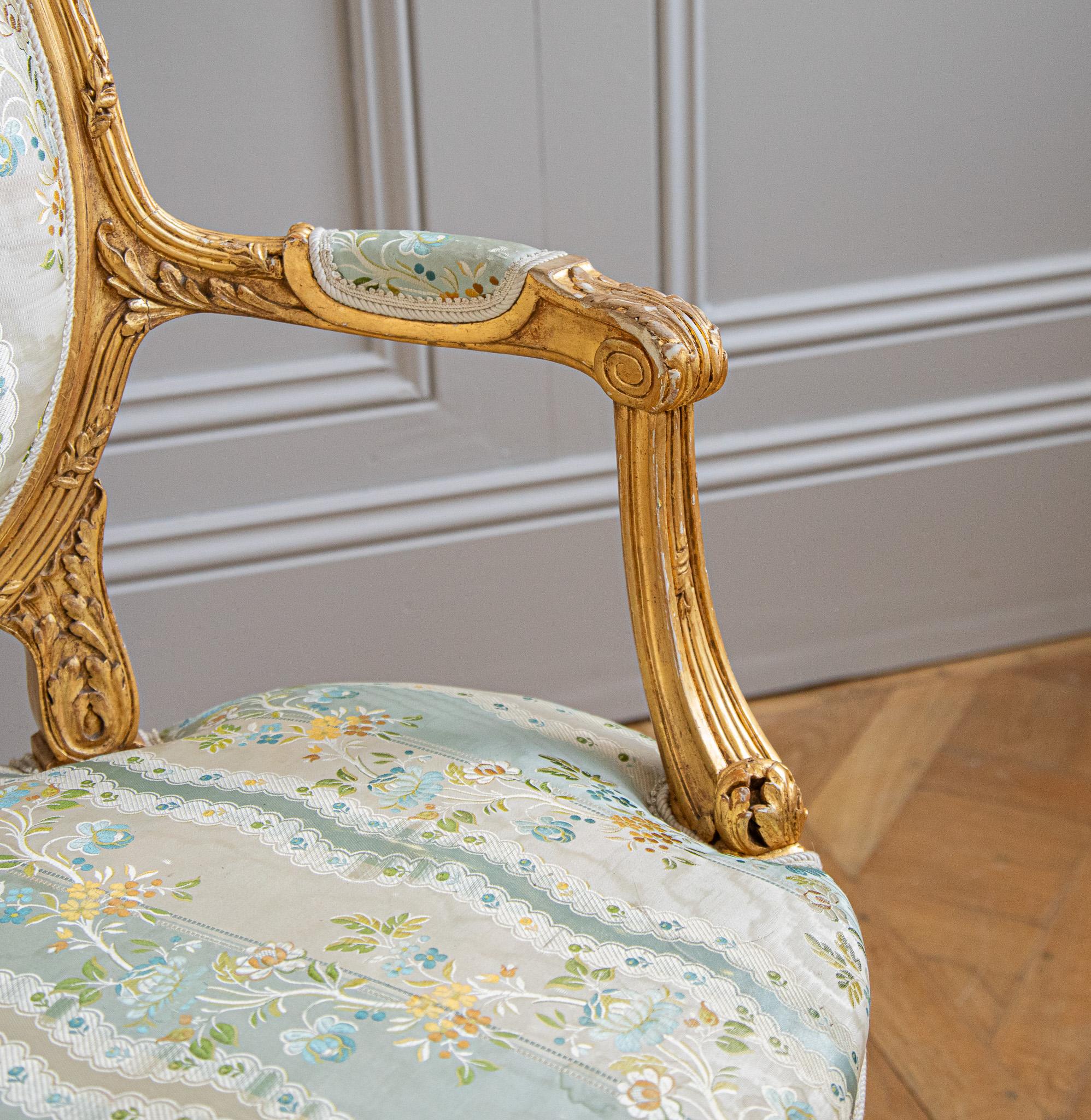 Hand-Carved French Louis XVI Style Giltwood Armchair & Foot stool, Circa Late 1800's For Sale