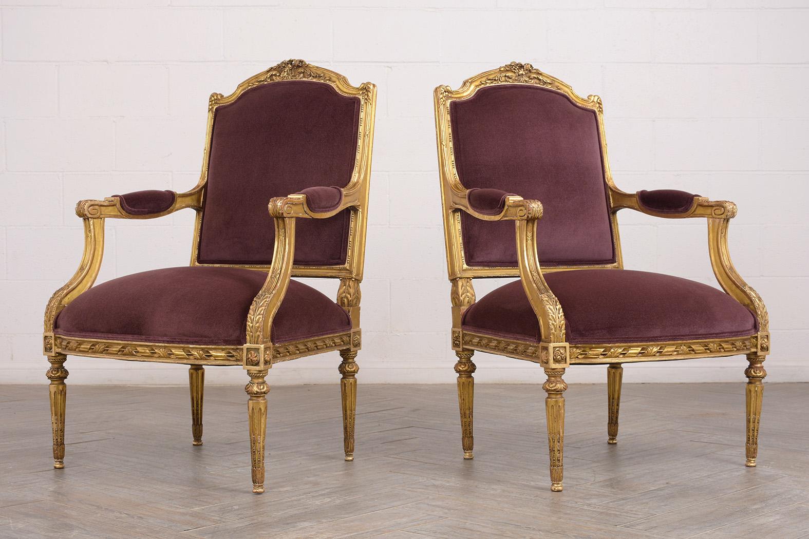 This pair of 1880s French Louis XVI-style armchairs have been completely restored. The giltwood frames feature the original finish and are adorned with intricately carved details of flowers, leaves, scrolls, and traditional motif decorative bands.