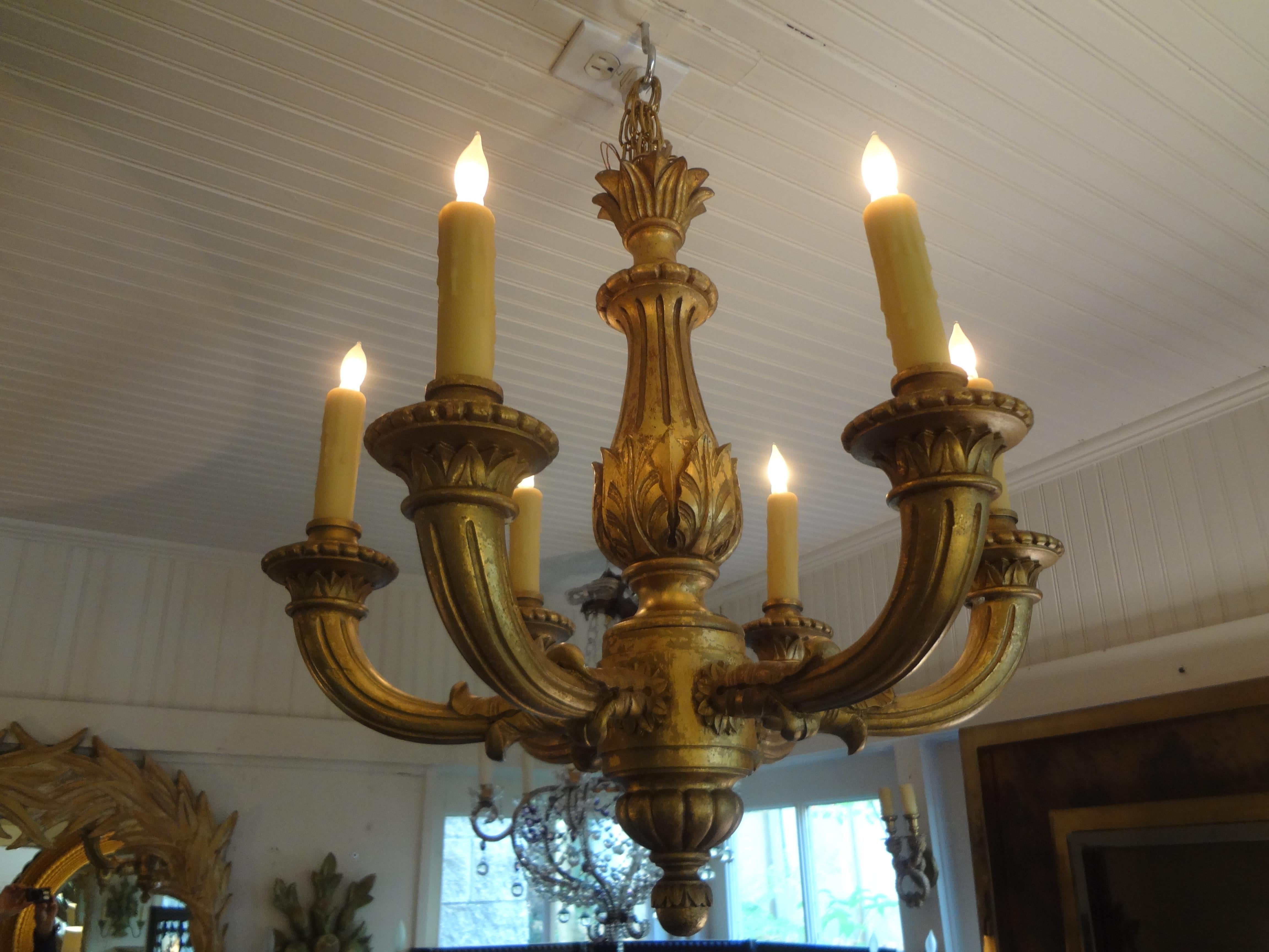 Stunning French Louis XVI style giltwood 6-light chandelier. This beautifully detailed carved French gilt wood chandelier that dates to the 1920s has been newly wired with new sockets to U.S. specifications. Great patina!