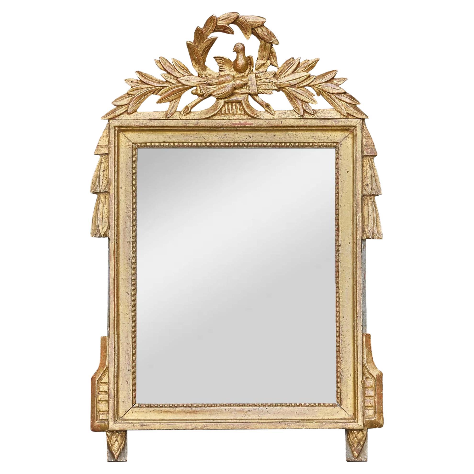 French Louis XVI Style Giltwood Mirror with Dove and Laurel Crest, circa 1920 For Sale