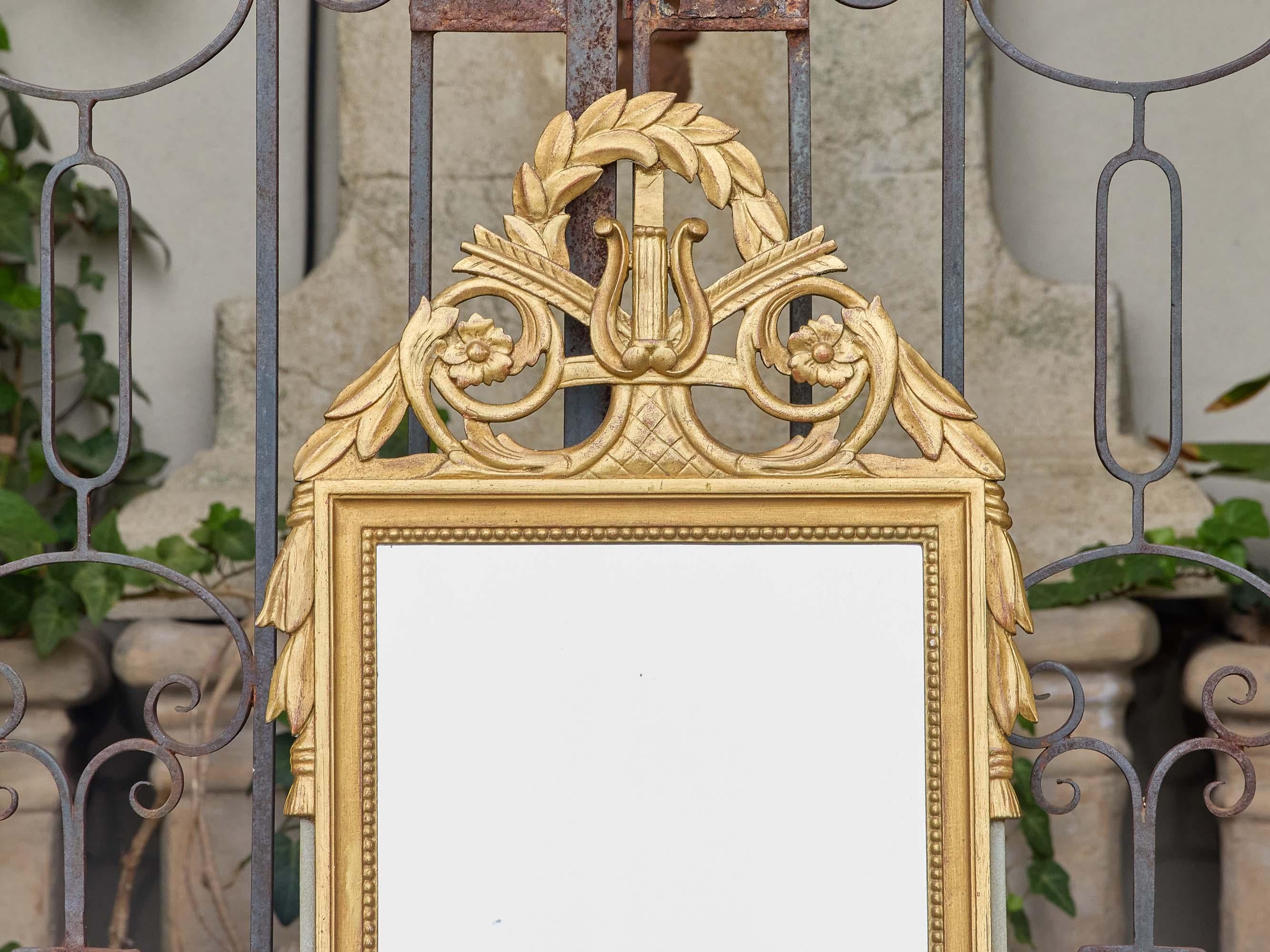 20th Century French Louis XVI Style Giltwood Mirror with Lyre and Laurel Crest, circa 1940 For Sale