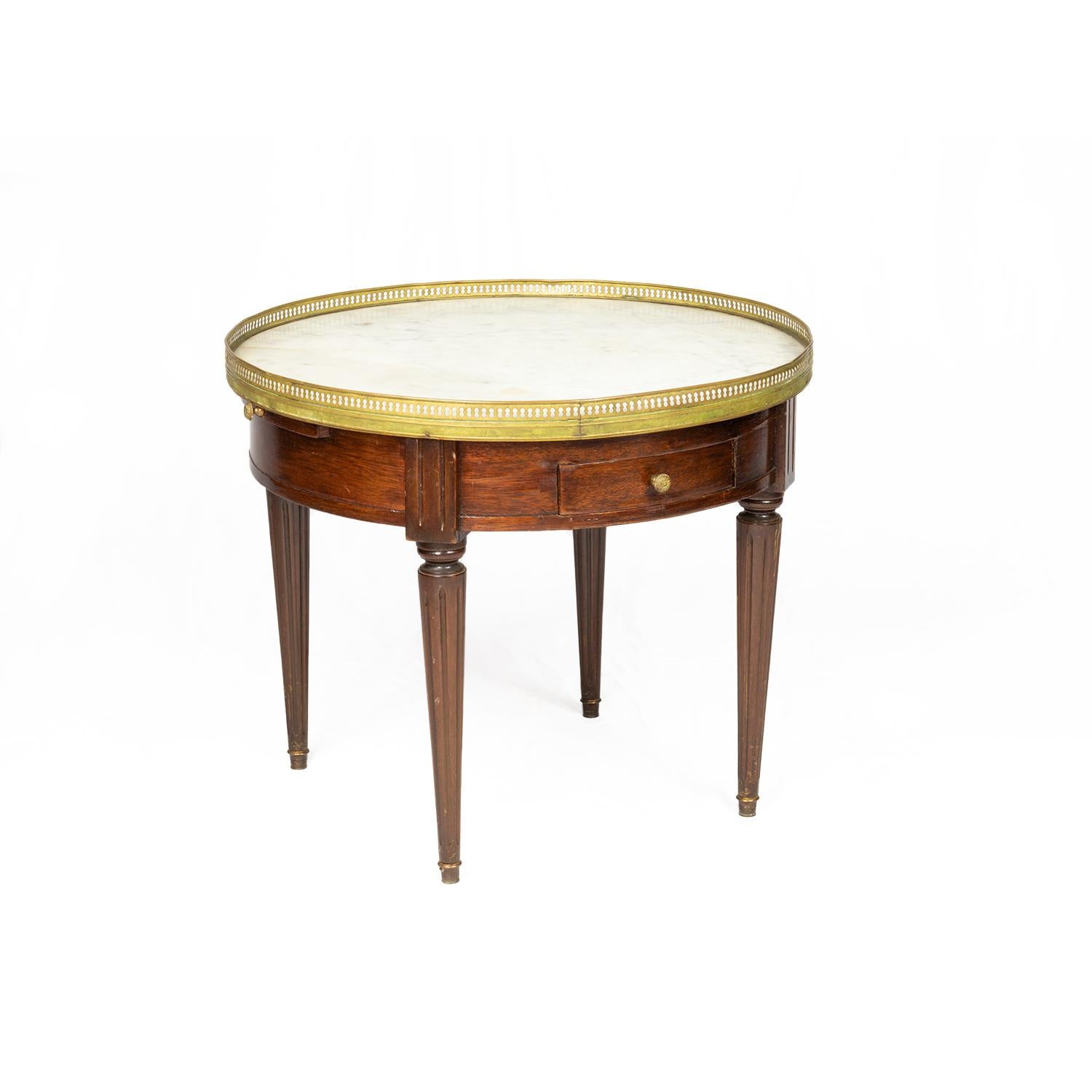 A unique 19th century Louis XVI Style round side table Bouillotte.
Marble top, golden rail, two drawers and extensions on each side for glasses with leather lining.
