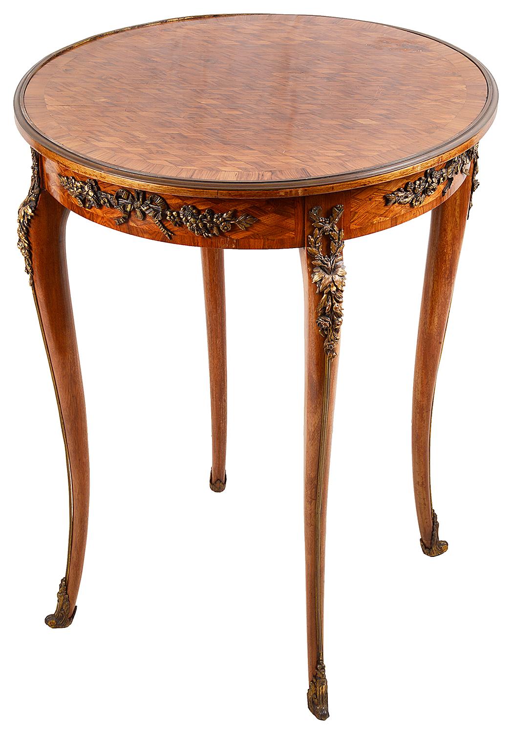 A very good quality 19th century parquetry inlaid side table / Gueridon, having gilded ormolu moldings and foliate swag mounts, raised on elegant cabriole legs, terminating in scrolling ormolu feet.
In the manner of 'Francoise Linke'. Measure: 59cm