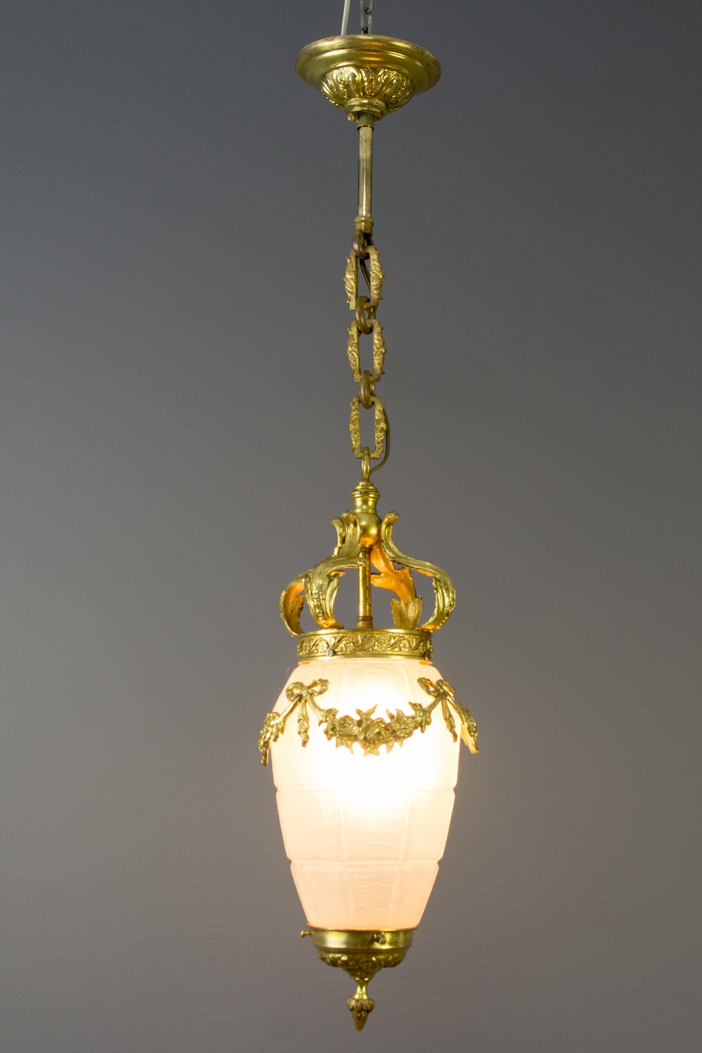 French Louis XVI style bronze, brass, and frosted crackled glass hall lantern, ceiling lamp from the 1930s.
In very good condition, one original socket for the E27 light bulb.
Measures: Height is 33.07 inches / 84 cm; diameter - 7.08 inches / 18
