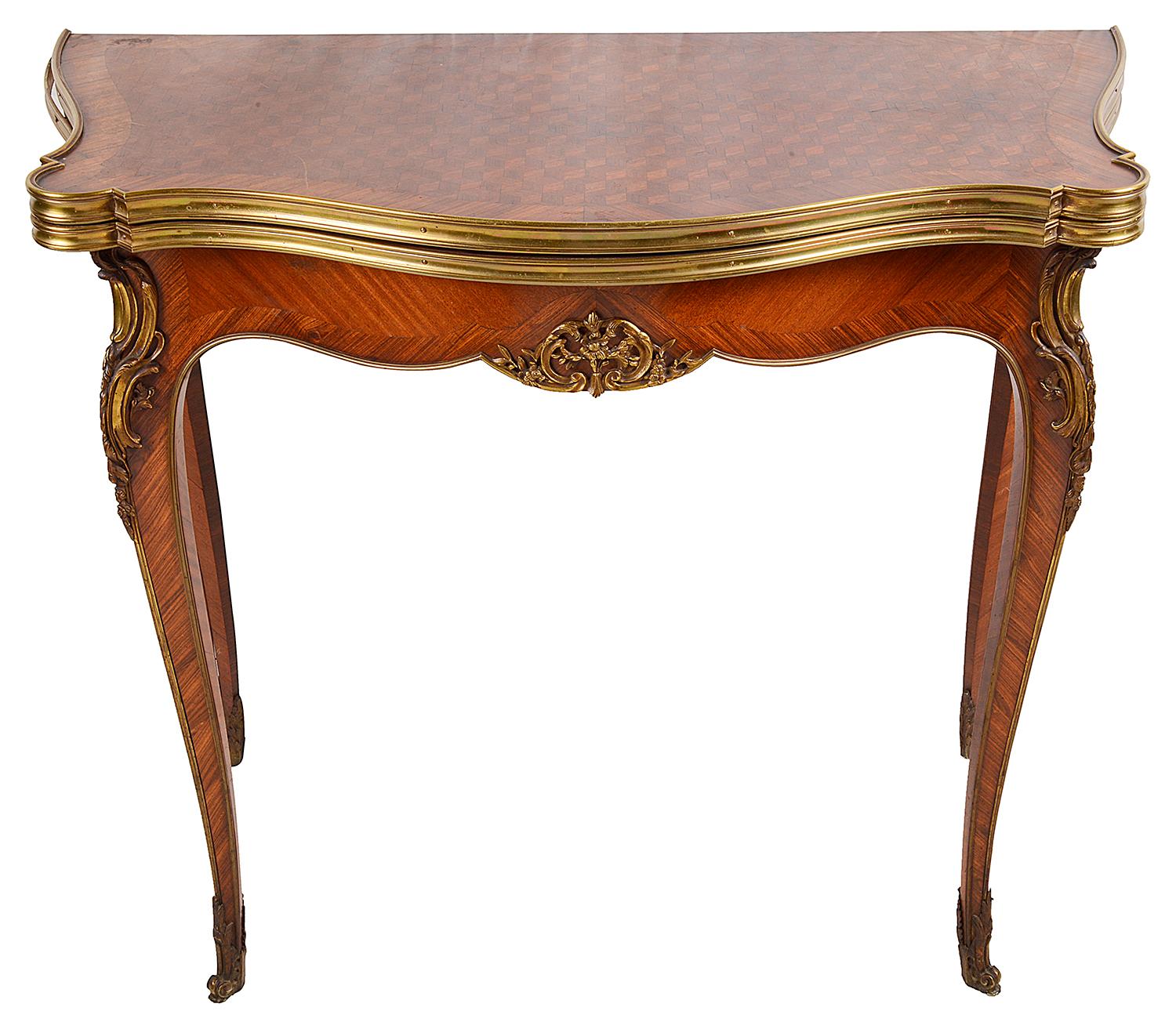 A good quality late 19th century Louis XVI style parquetry inlaid serpentine fronted card or games table, having gilded ormolu moldings and mounts, the top hinging open to reveal the baize covered card table. Raised on elegant cabriole legs,
