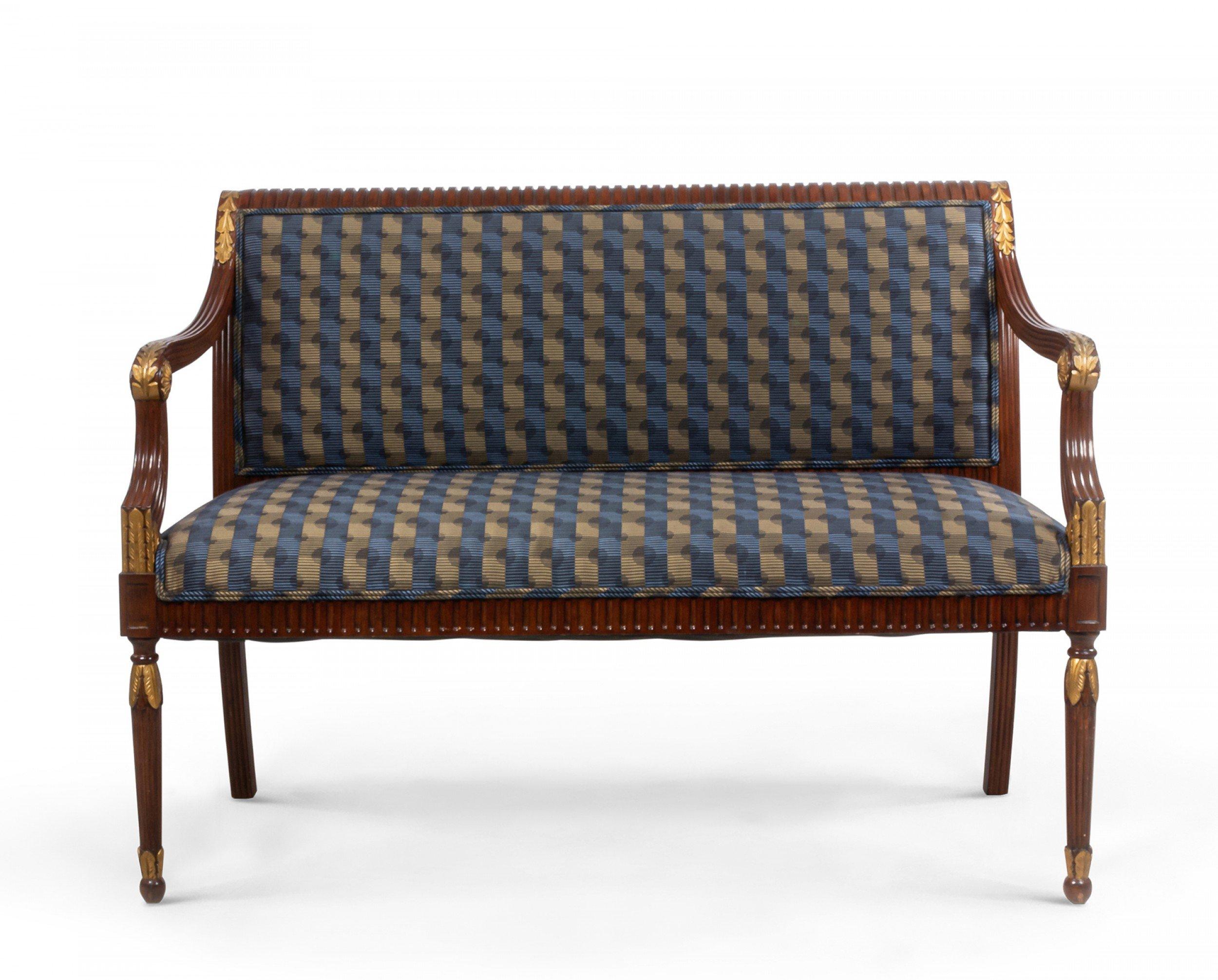 French Louis XVI style (20th Century) loveseat with blue and gray optic upholstery with a reeded mahogany frame with gold metal plaques in the shape of laurel leaves along curved arms and at legs.