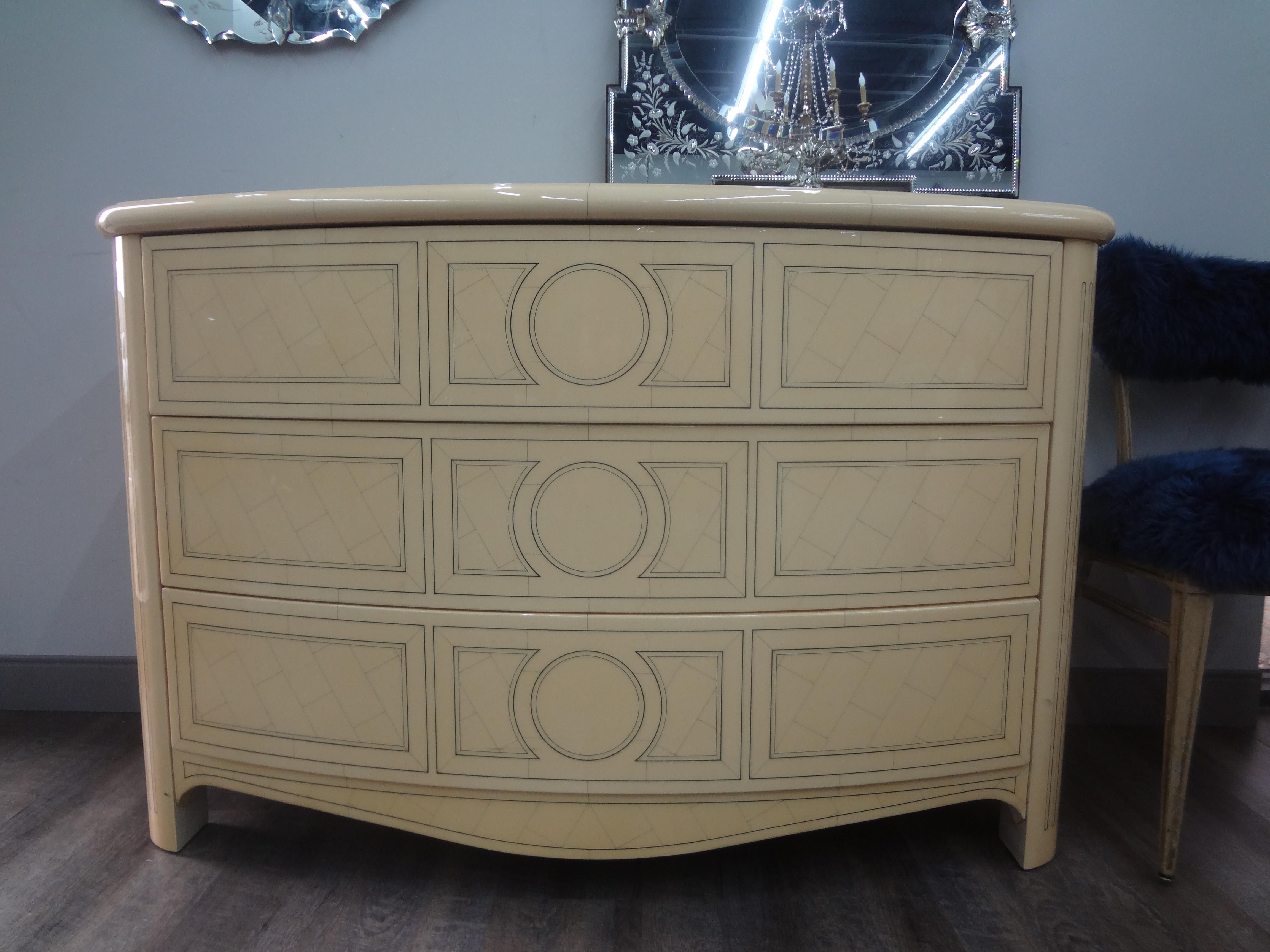 French Louis XVI style Maison Jansen lacquered commode.
This stunning vintage French Louis XVI style Maison Jansen three drawer commode, credenza or chest is lacquered a lovely ivory color with a geometric design on the front, sides and top.
It
