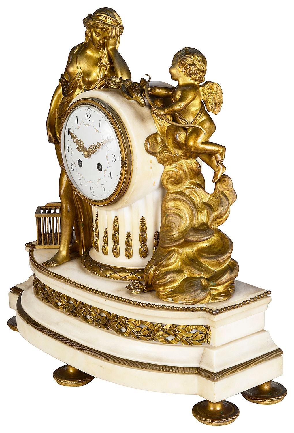 A good quality French gilded ormolu and white marble, 19th Century Louis XVI style mantel clock, with a classical maiden resting, a bird cage at her feet, a cherub holding a bow and arrow among clouds. The eight day duration clock, strikes on the