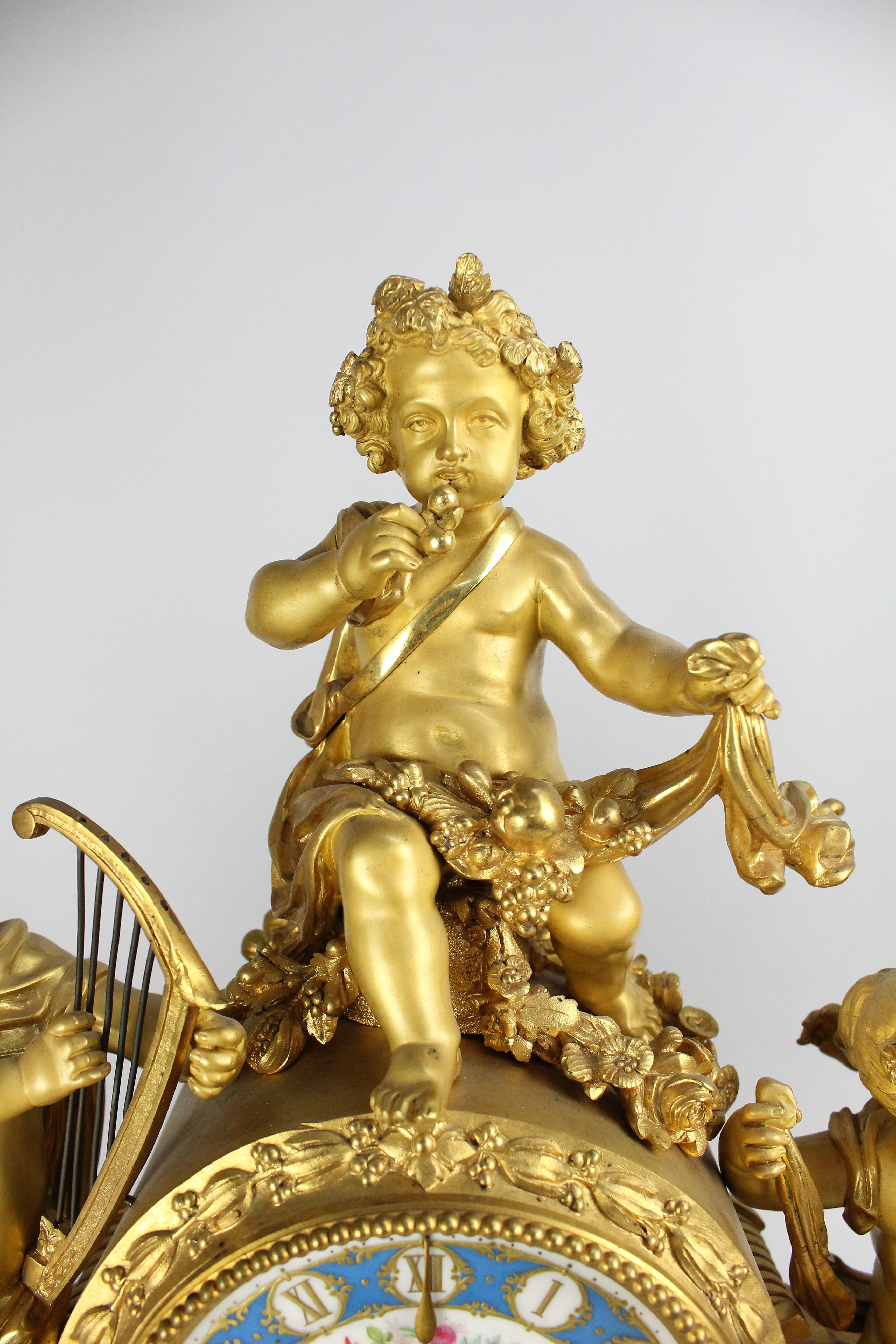 The young Bacchus and friends are entertaining themselves with grapes and music.

Large and impressive bronze mantel clock. French late 19th century. The movement is signed 