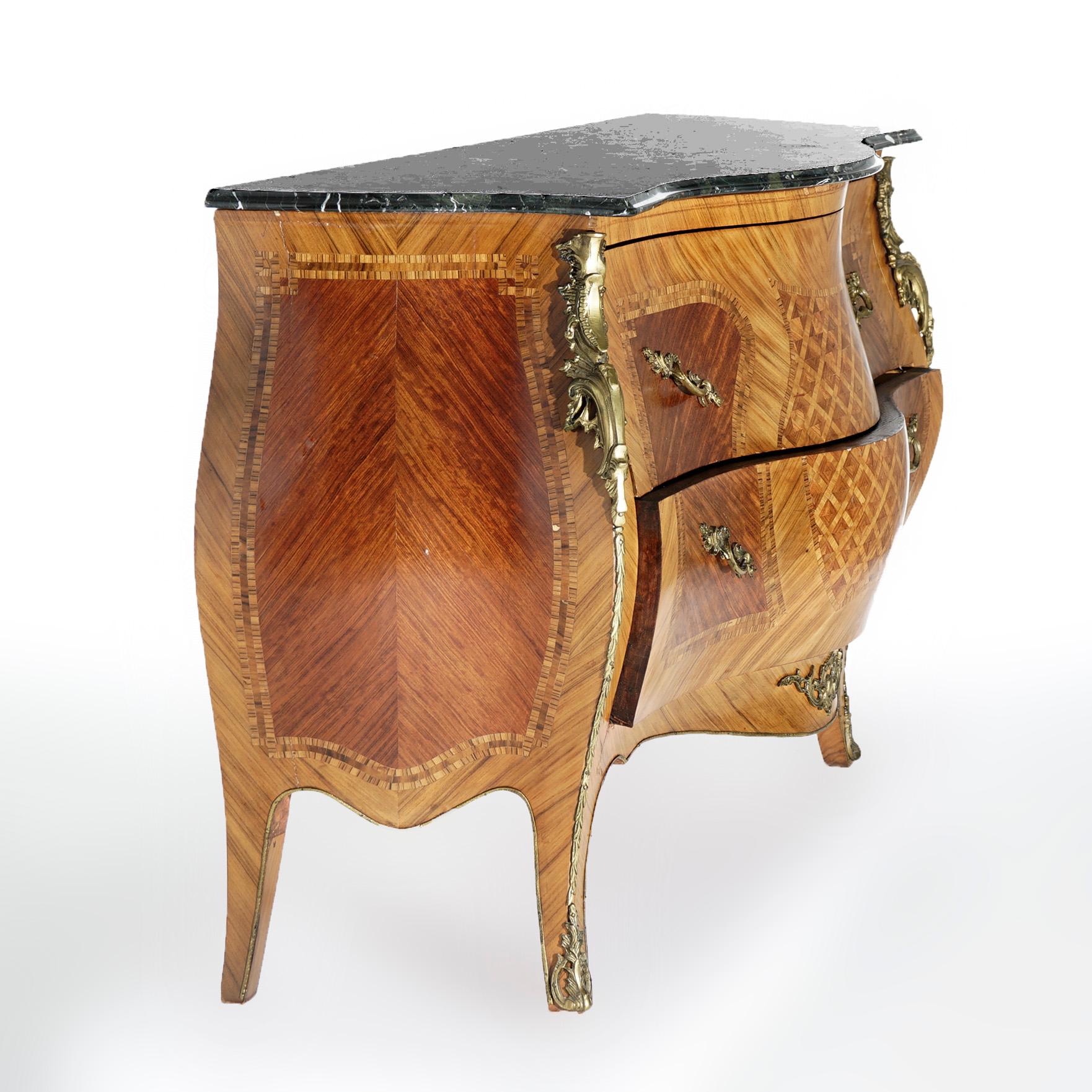 An antique French Louis XVI style double drawer commode offers shaped marble top over serpentine form bombe chest having inlaid marquetry reserves and central lattice design, foliate cast ormolu mounts throughout, 20th century.

Measures- 36''H x